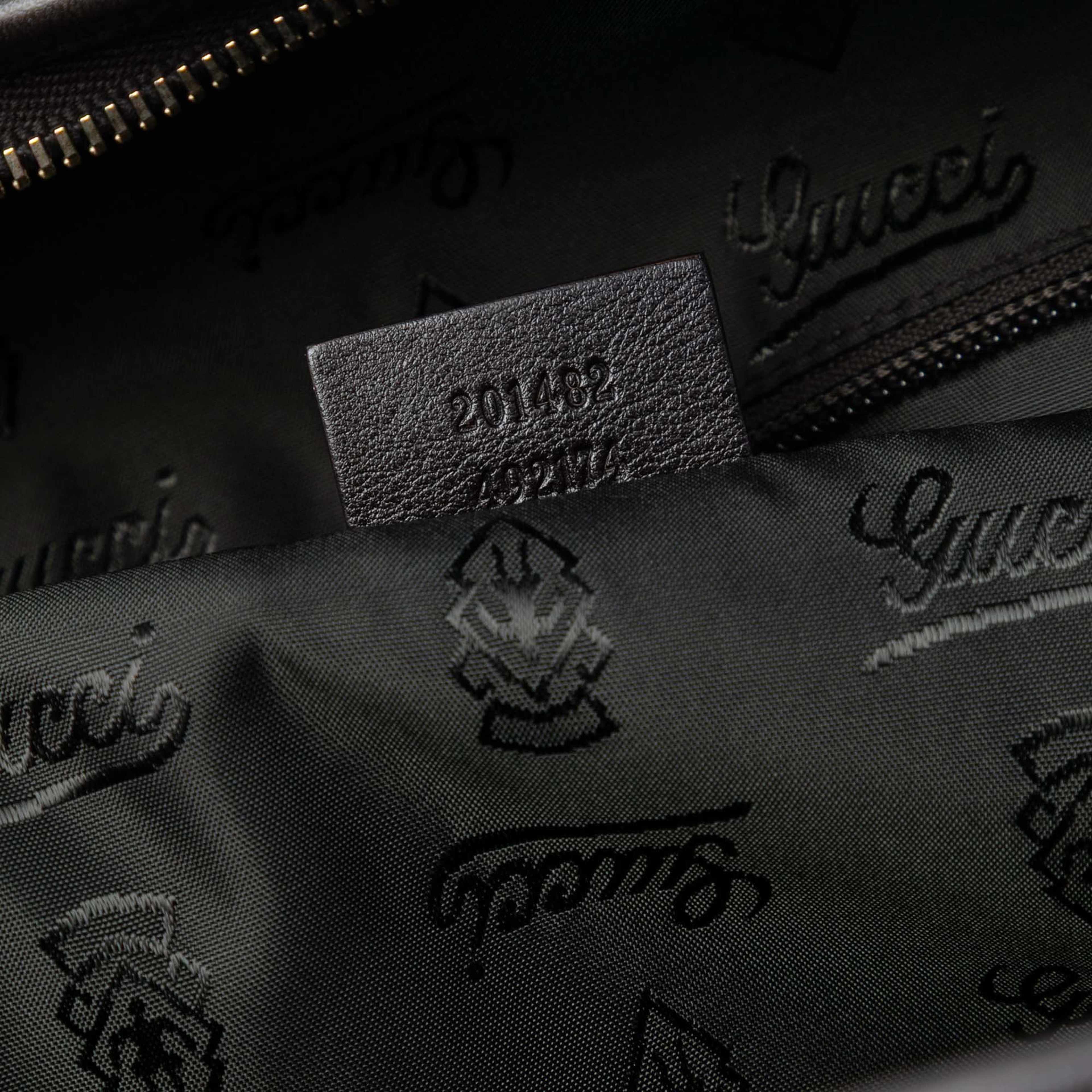 Gucci Guccissima Weekender, från Luxclusif, i färgen dark brown. Klicka för att öppna bilden i stort format