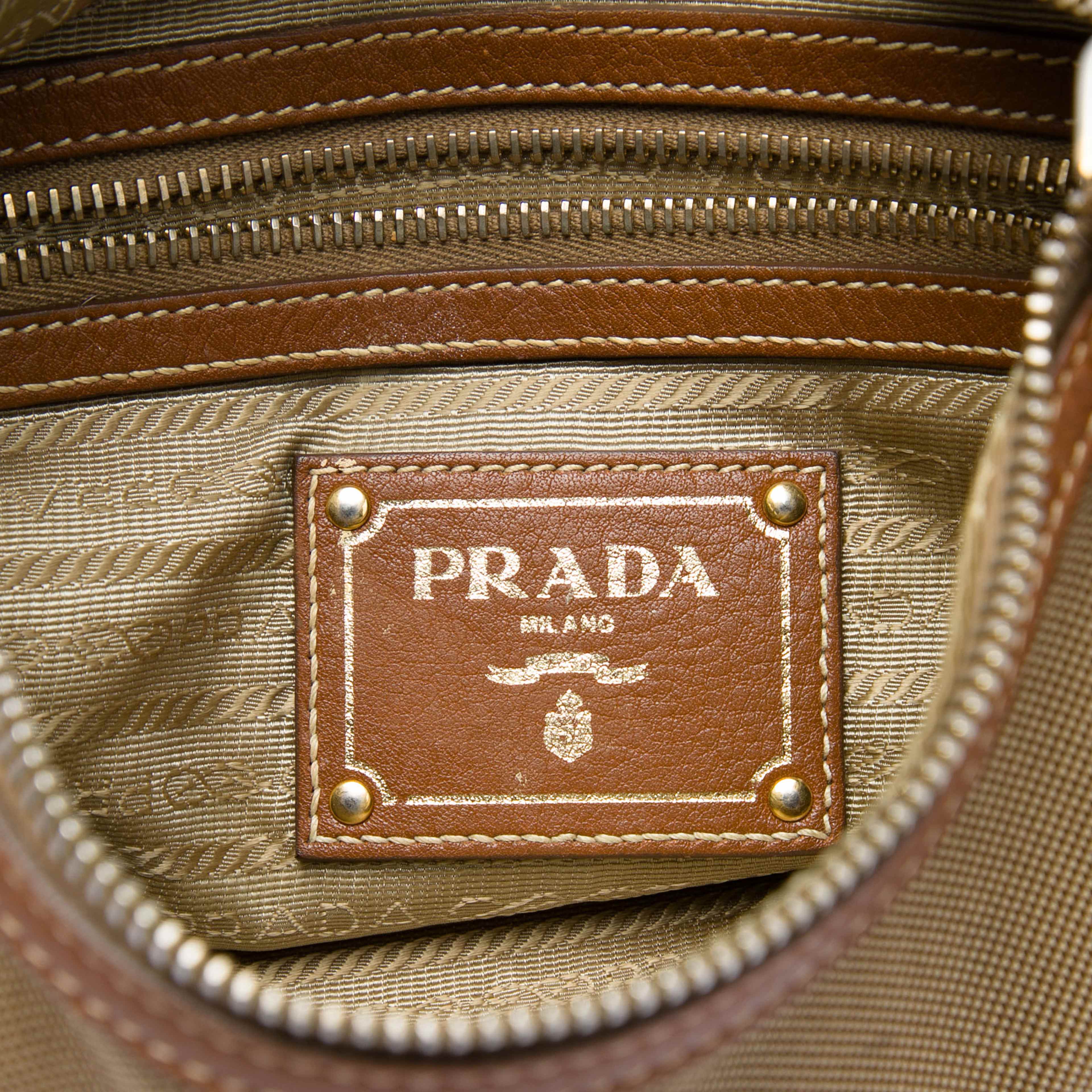 Prada Canvas Canapa Logo Crossbody, från Luxclusif, i färgen beige. Klicka för att öppna bilden i stort format