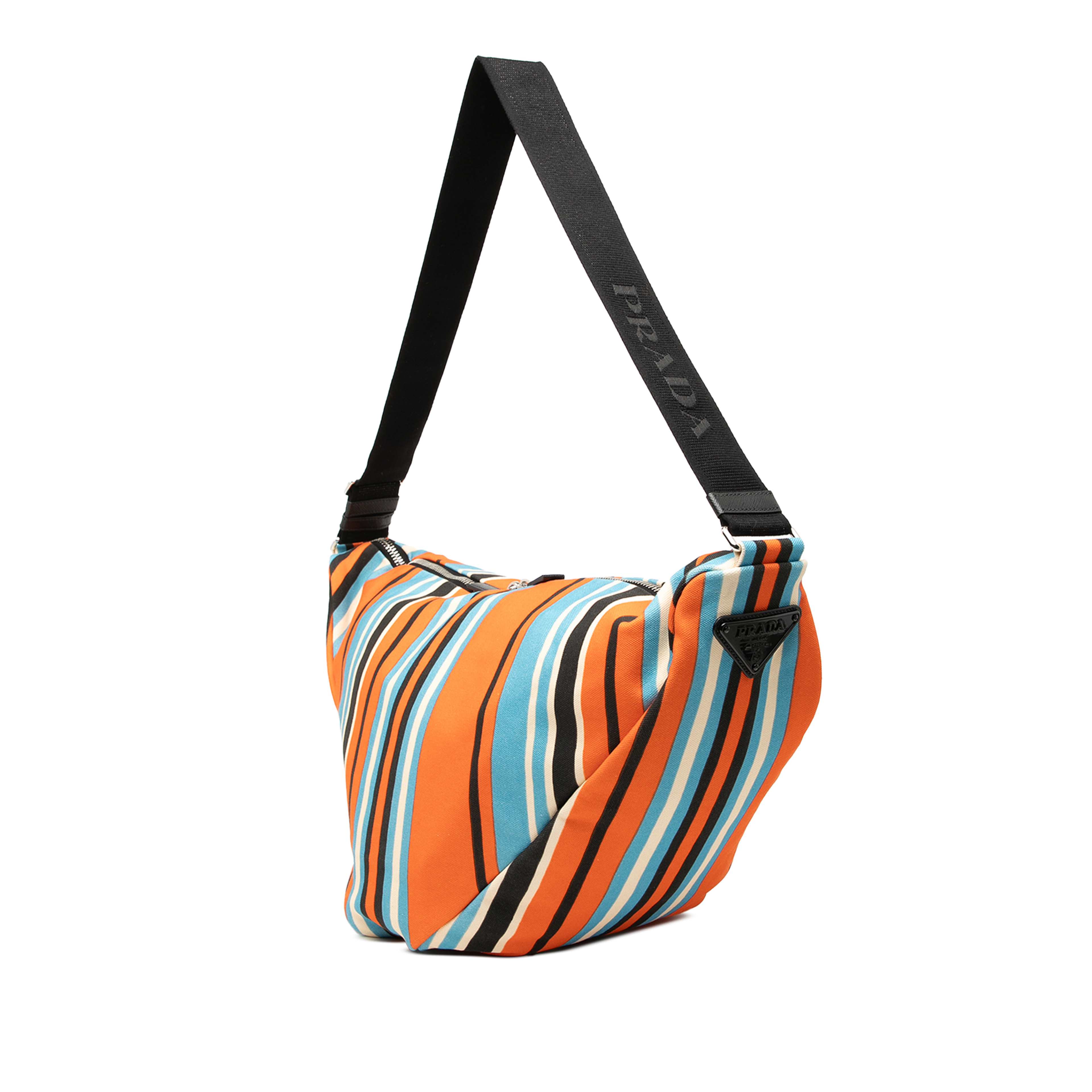 Prada Canvas Canapa Baiadera Triangle Logo Shoulder Bag, från Luxclusif, i färgen blå. Klicka för att öppna bilden i stort format