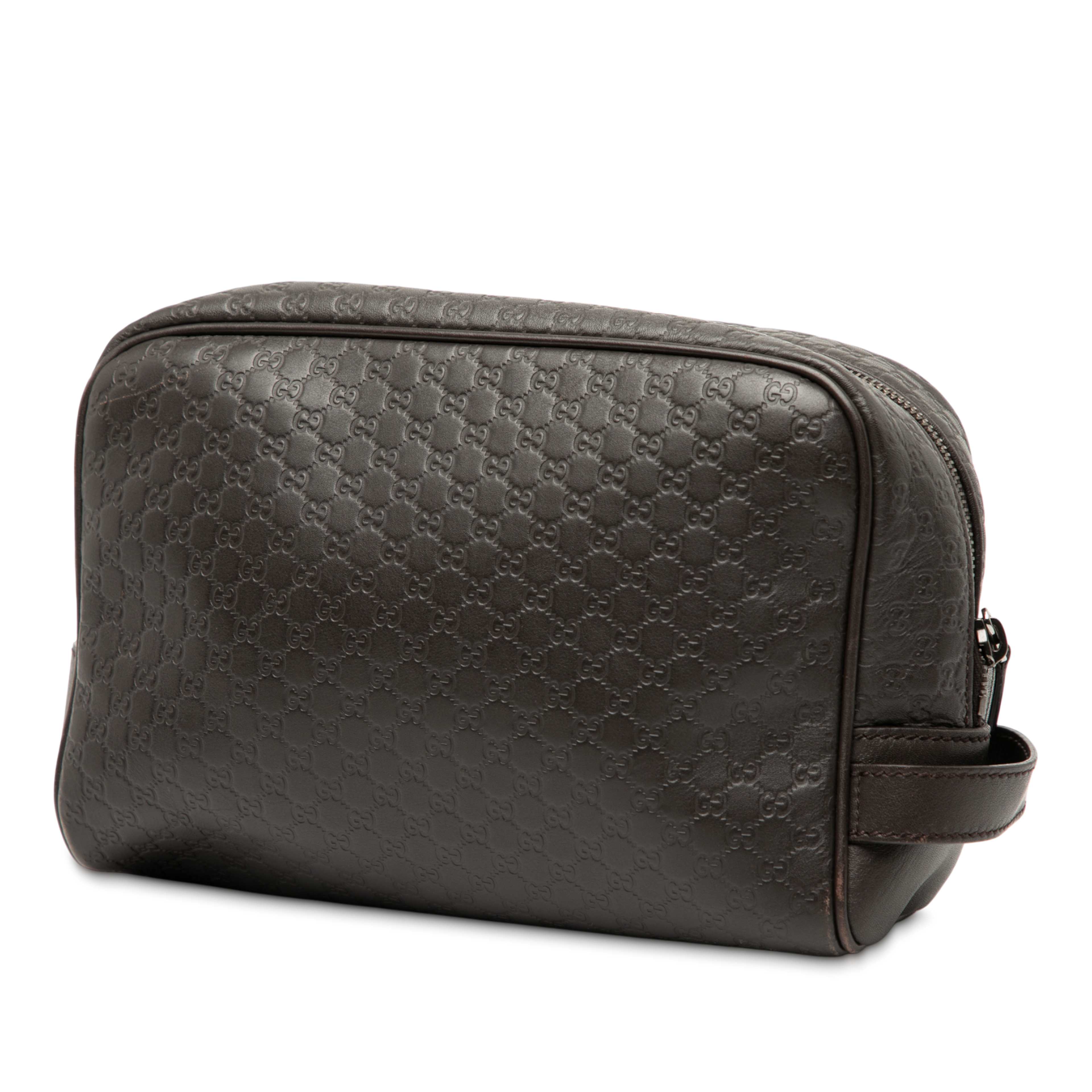 Gucci Microguccissima Clutch, från Luxclusif, i färgen dark brown. Klicka för att öppna bilden i stort format