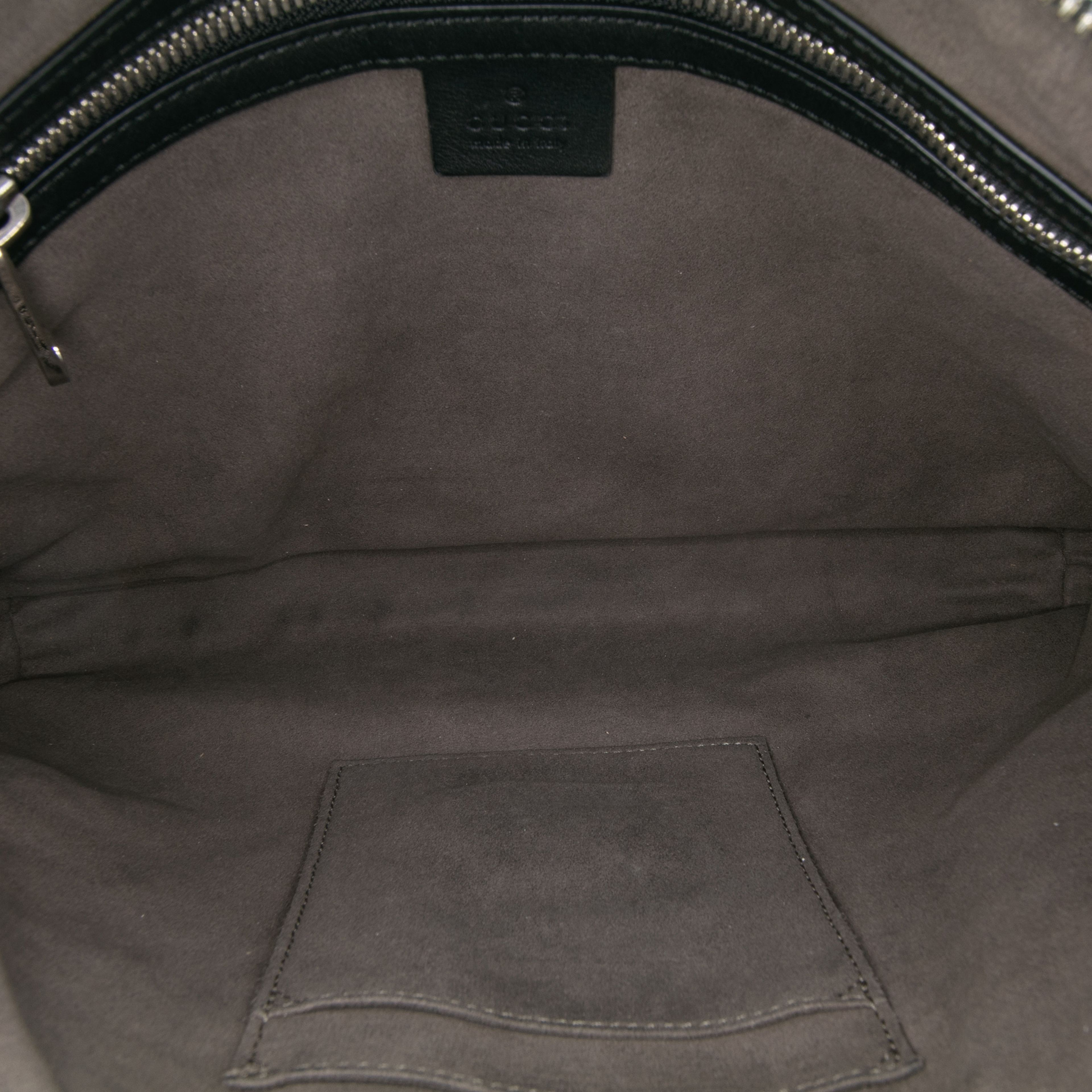 Gucci Guccissima Wristlet Clutch, från Luxclusif, i färgen black. Klicka för att öppna bilden i stort format