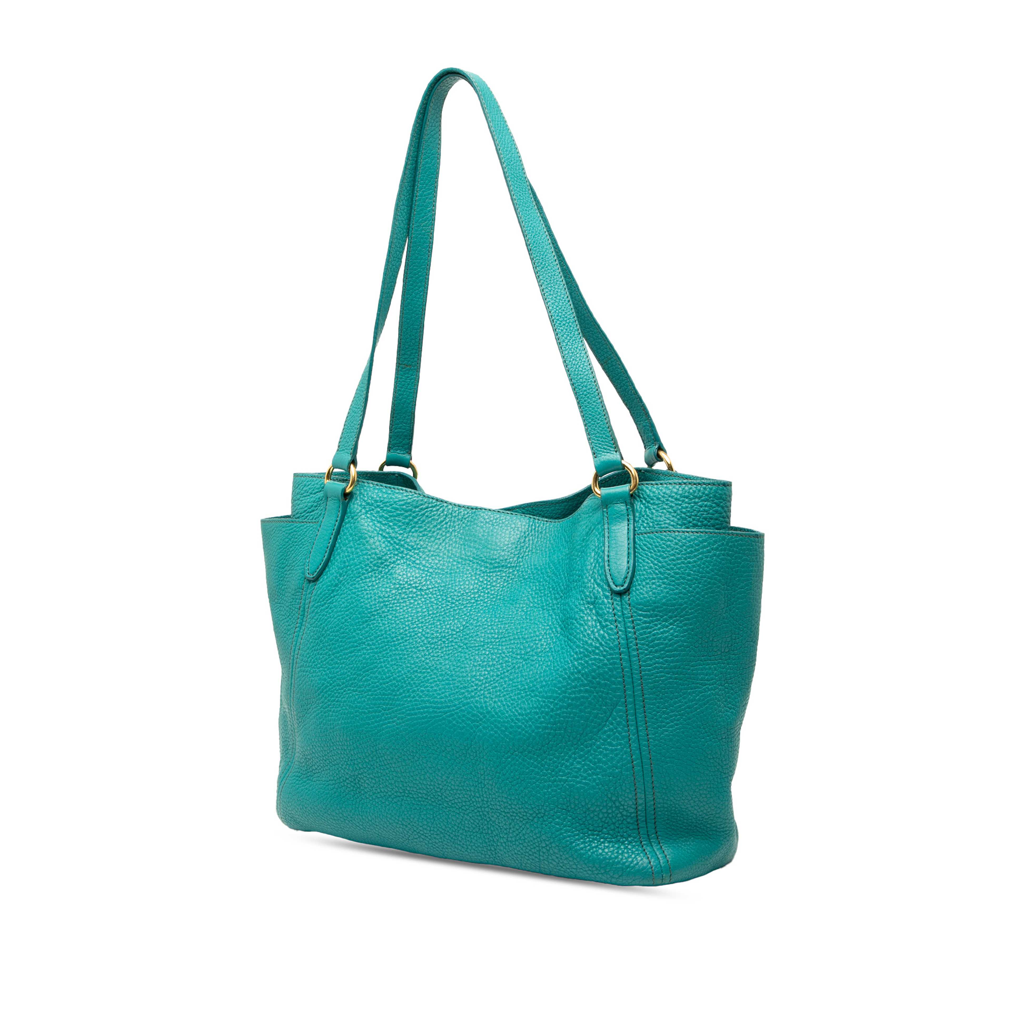Prada Vitello Daino Side Pocket Tote, från Luxclusif, i färgen turquoise. Klicka för att öppna bilden i stort format