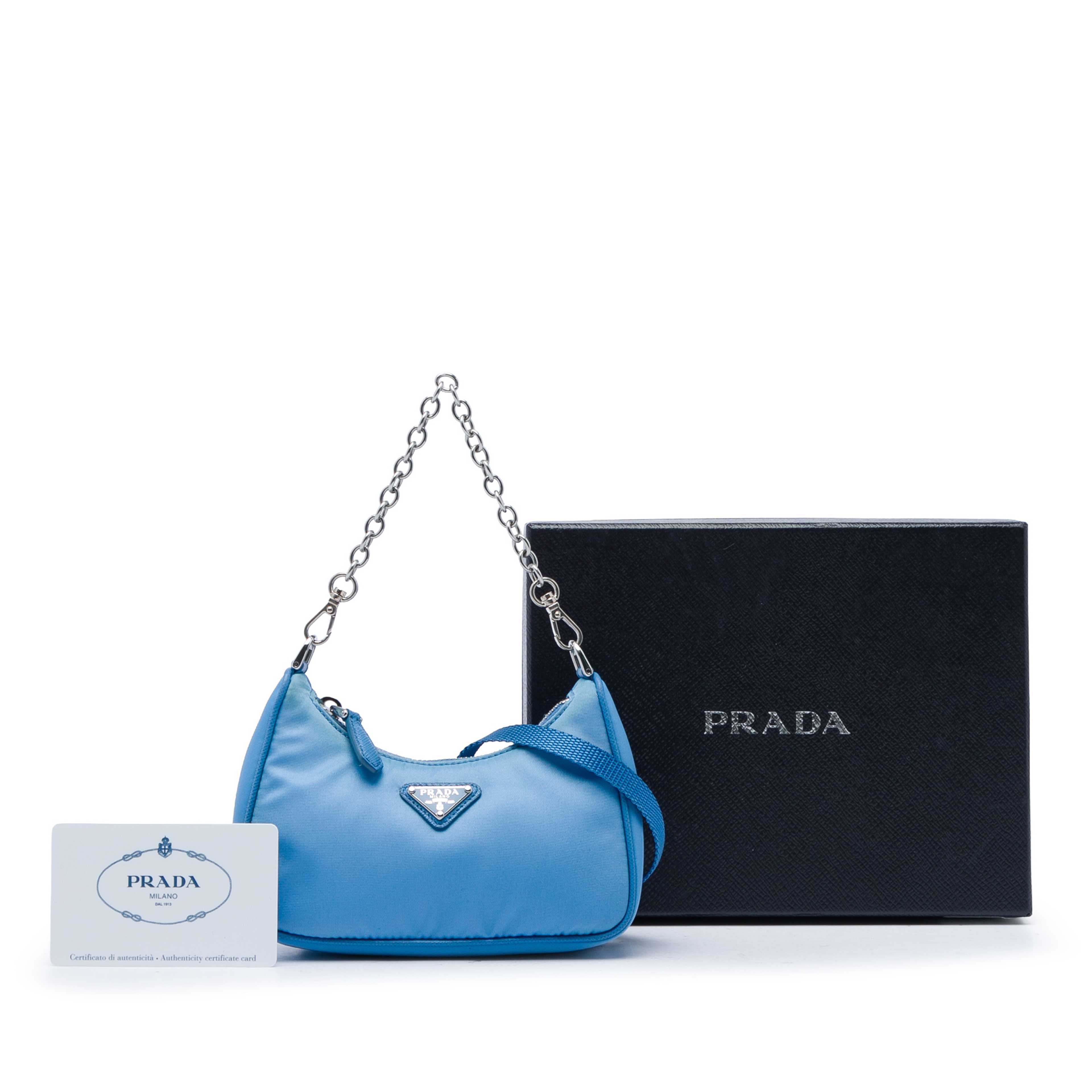 Prada Mini Saffiano Trimmed Tessuto Re Edition 2005 Satchel, från Luxclusif, i färgen blå. Klicka för att öppna bilden i stort format