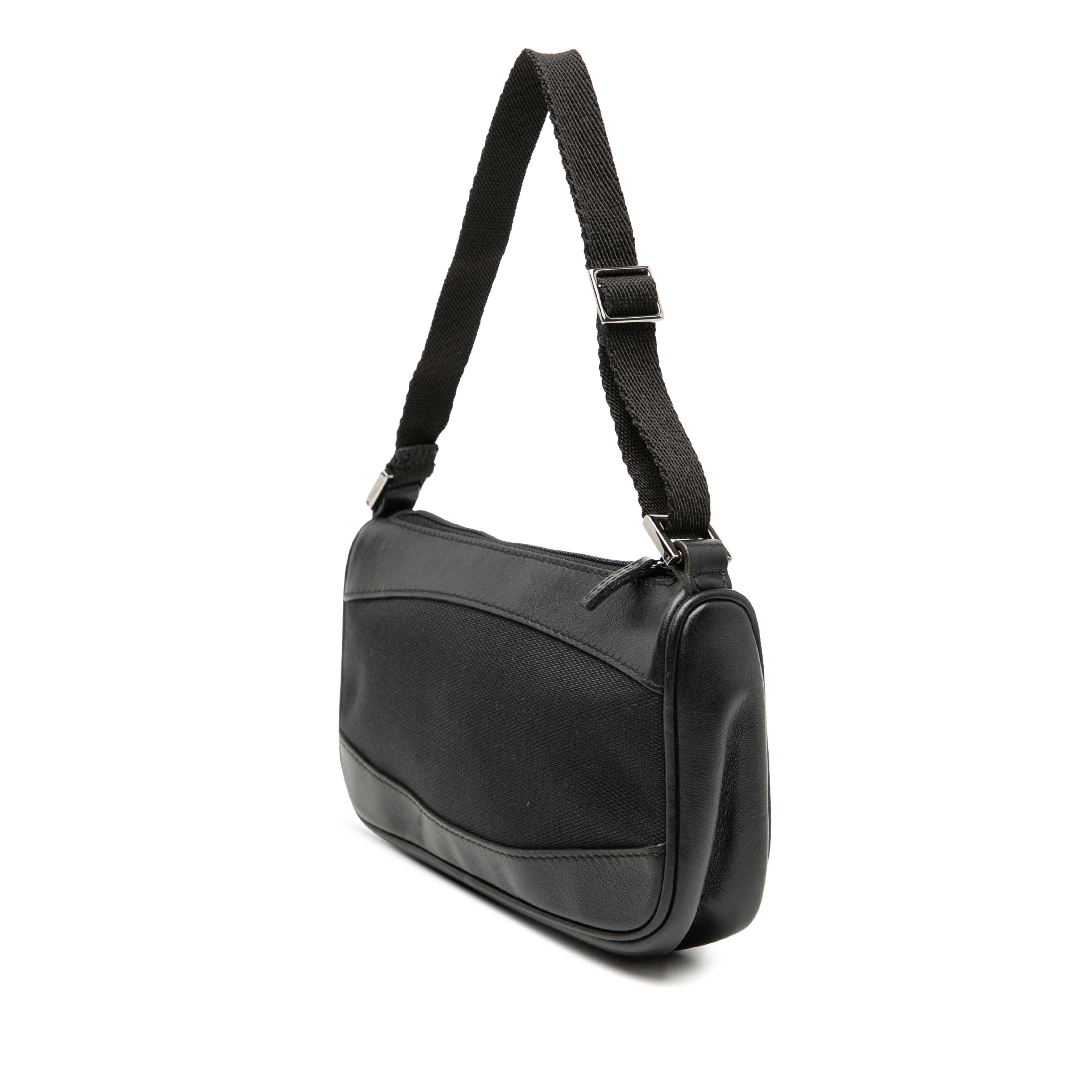 Gucci Leather Trimmed Canvas Shoulder Bag, från Luxclusif, i färgen svart. Klicka för att öppna bilden i stort format
