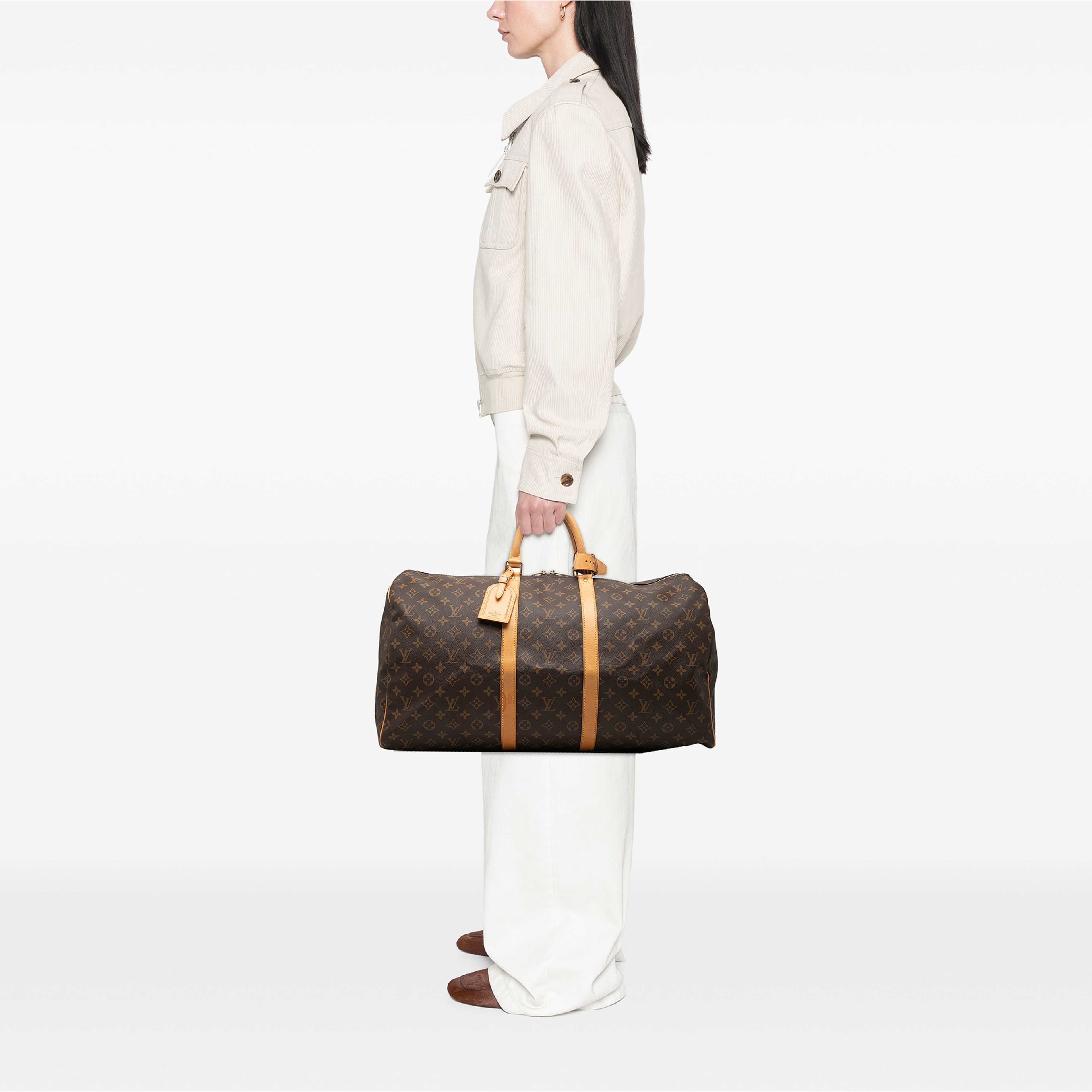Louis Vuitton Monogram Keepall 55, från Luxclusif, i färgen brun. Klicka för att öppna bilden i stort format