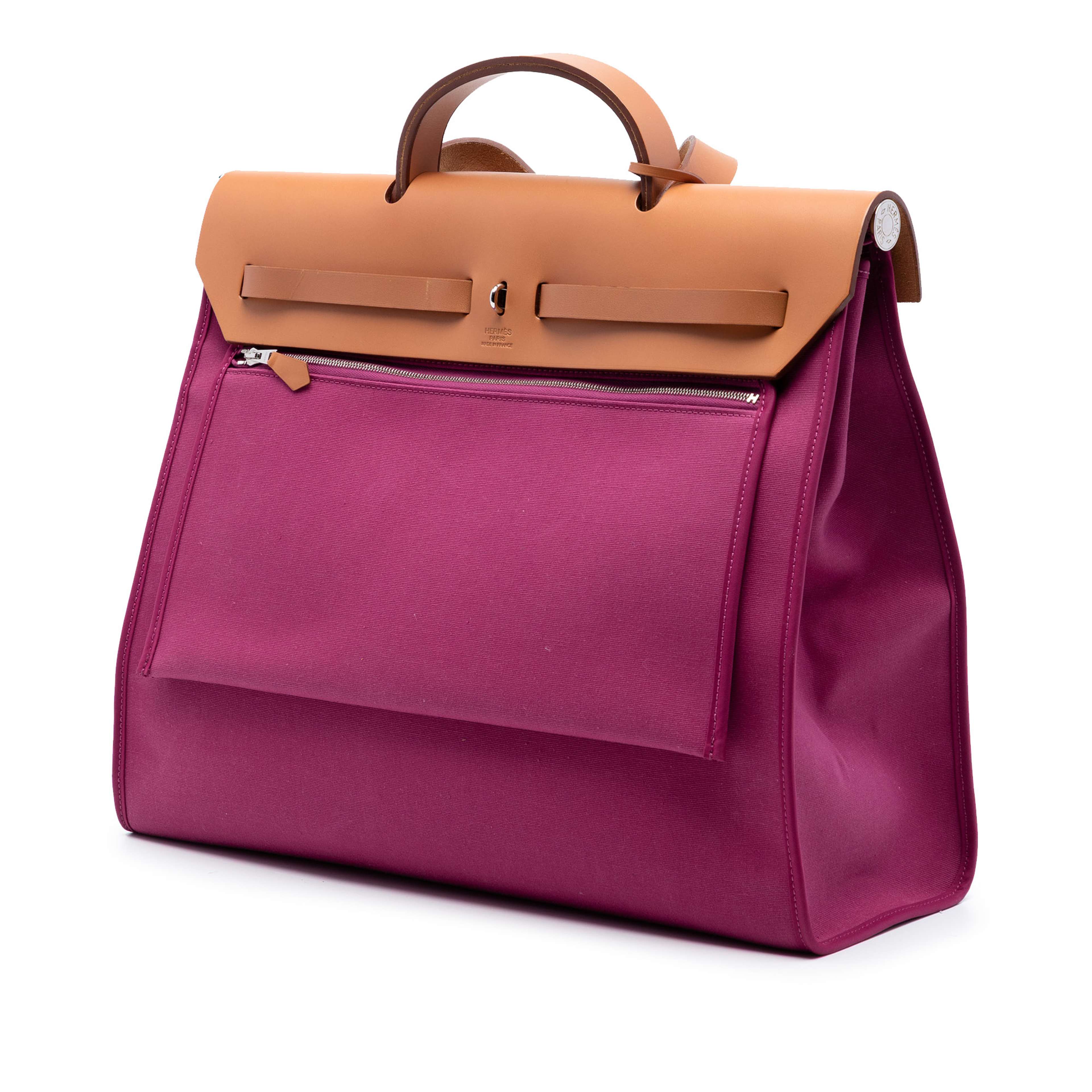 Hermès Toile Herbag Zip 39, från Luxclusif, i färgen pink. Klicka för att öppna bilden i stort format