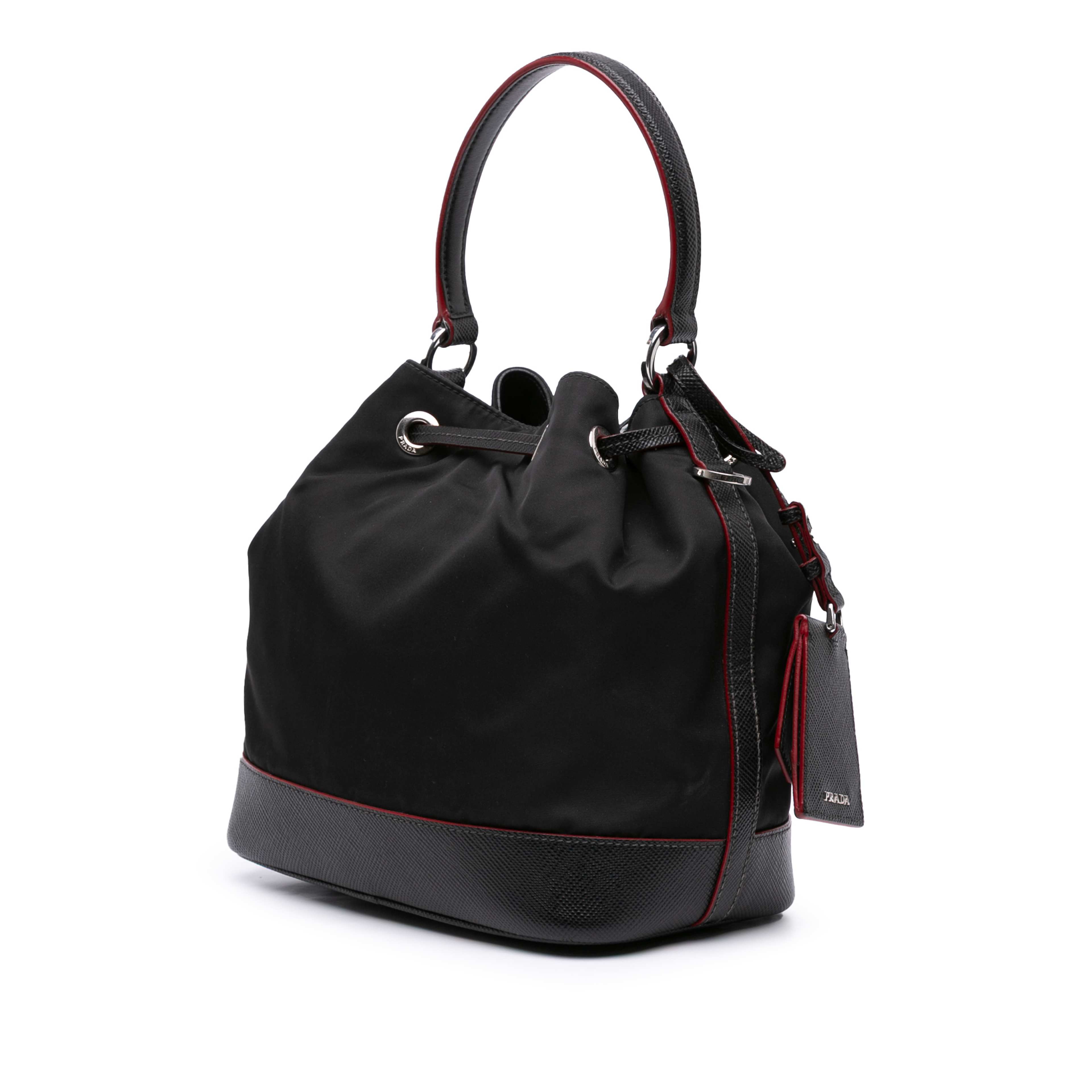 Prada Saffiano Trimmed Tessuto Bucket Bag, från Luxclusif, i färgen black. Klicka för att öppna bilden i stort format