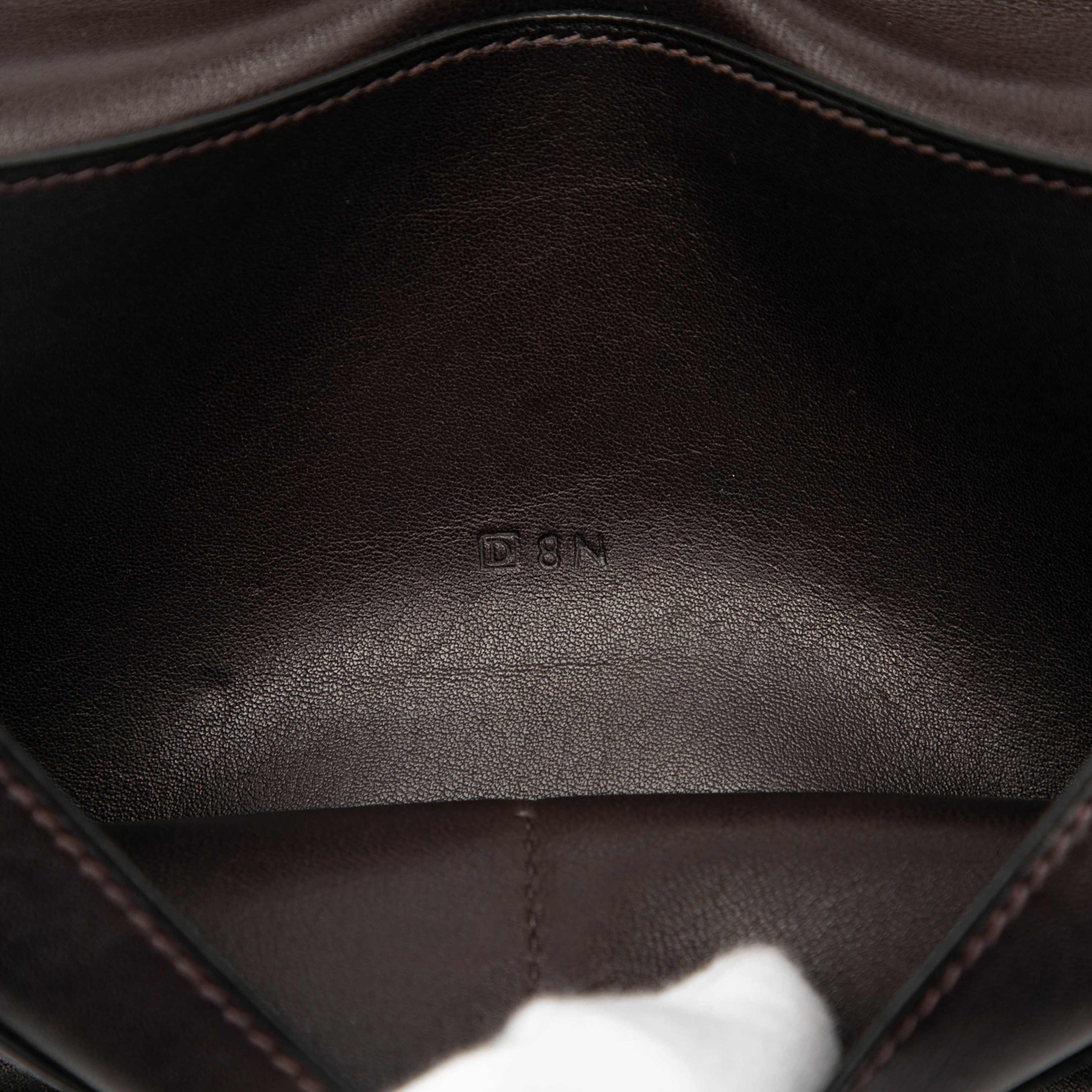 Hermès Swift Dogon Duo Wallet Gm, från Luxclusif, i färgen dark brown. Klicka för att öppna bilden i stort format