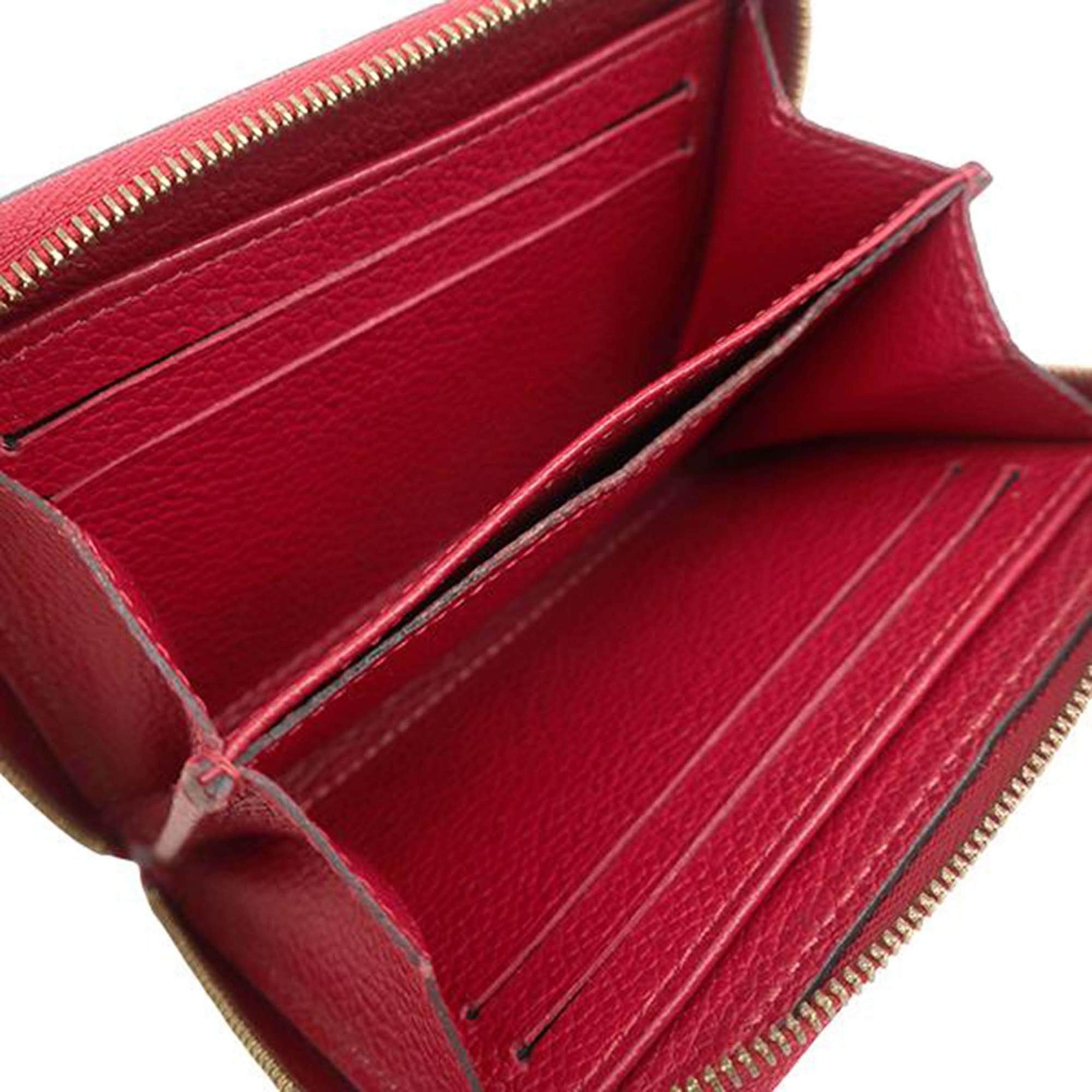 Louis Vuitton Monogram Empreinte Zippy Coin Purse, från Luxclusif, i färgen red. Klicka för att öppna bilden i stort format