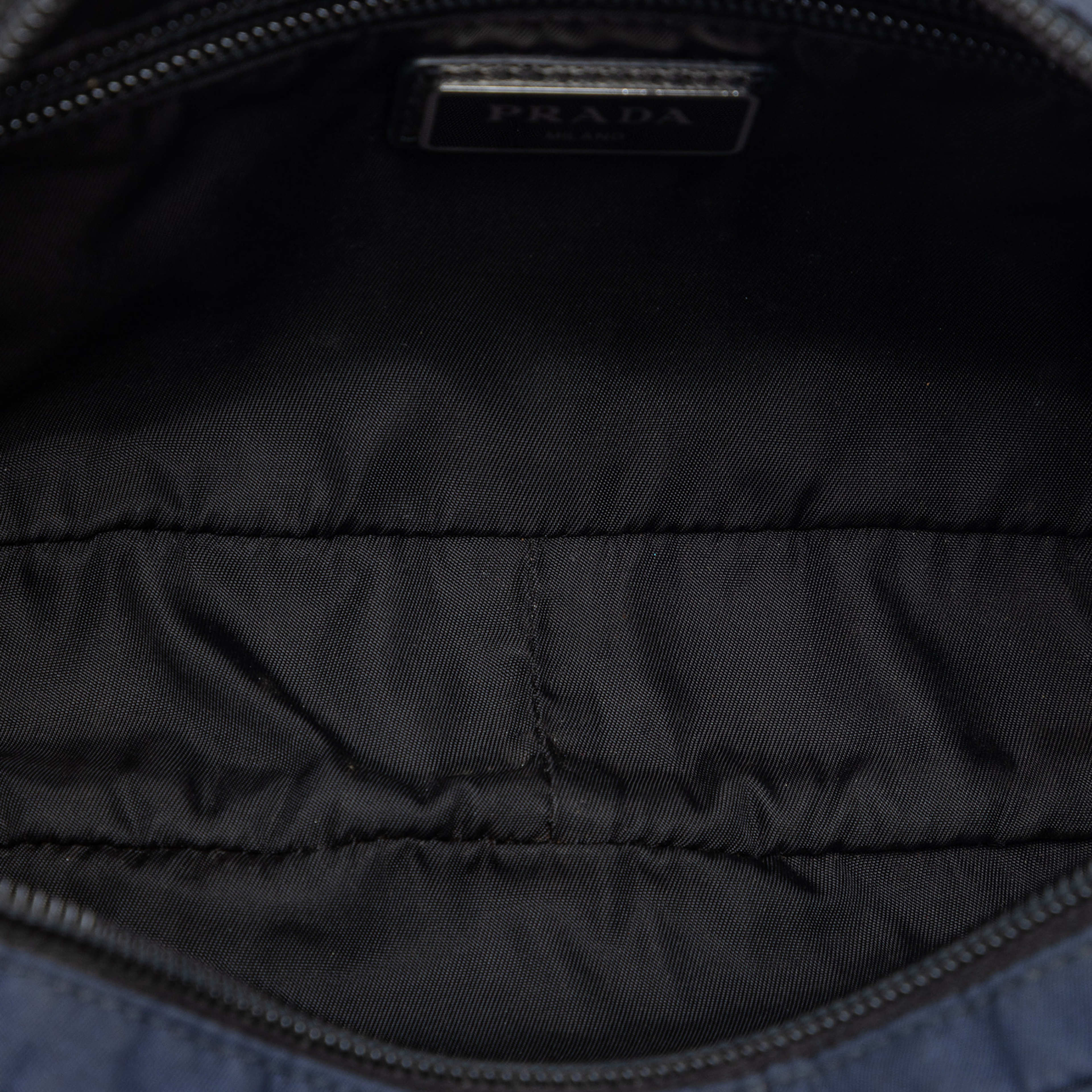 Prada Universal Studios Tessuto Frankenstein Thunder Belt Bag, från Luxclusif, i färgen navy. Klicka för att öppna bilden i stort format