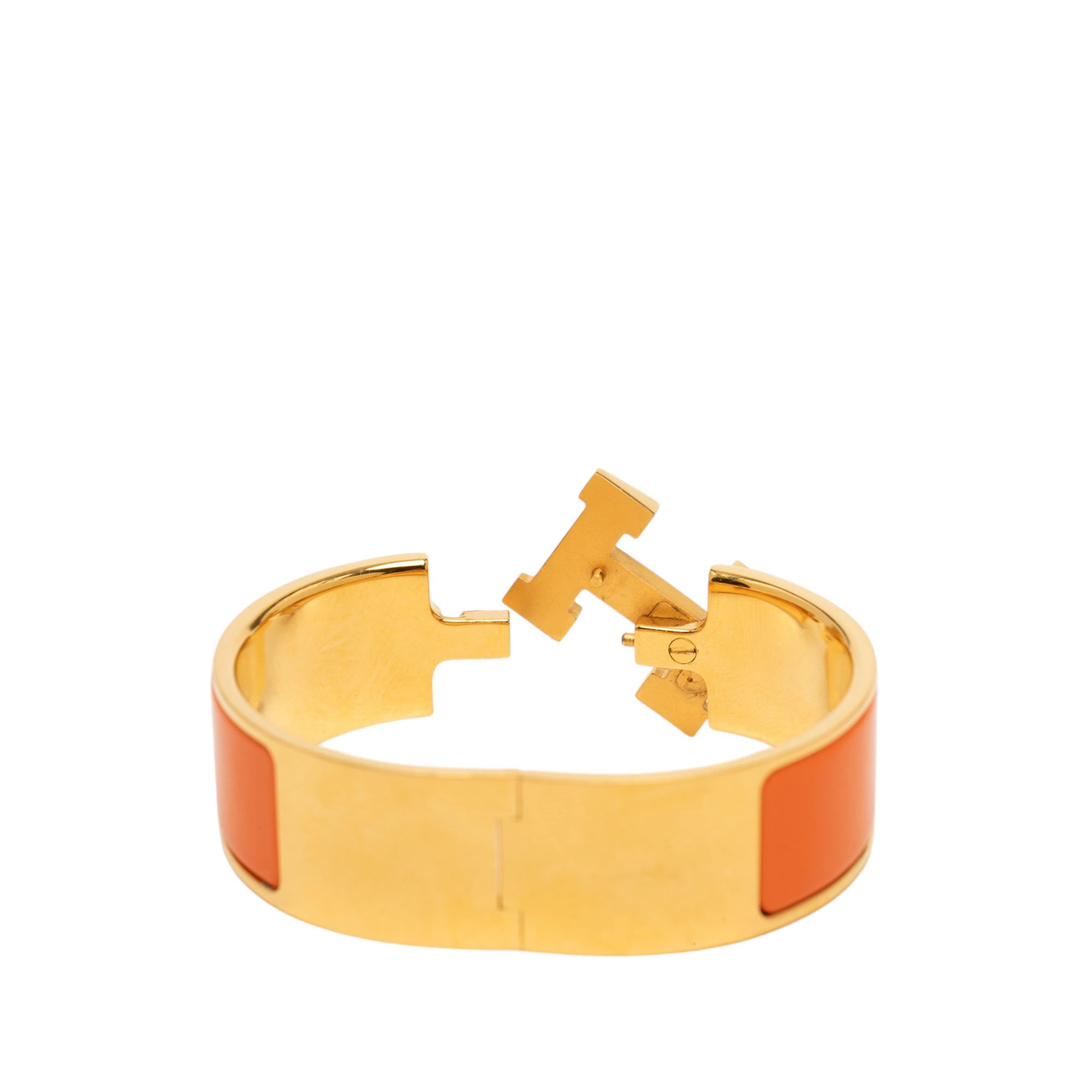 Hermès Wide Enamel Clic Clac H Bracelet Gm, från Luxclusif, i färgen guld. Klicka för att öppna bilden i stort format