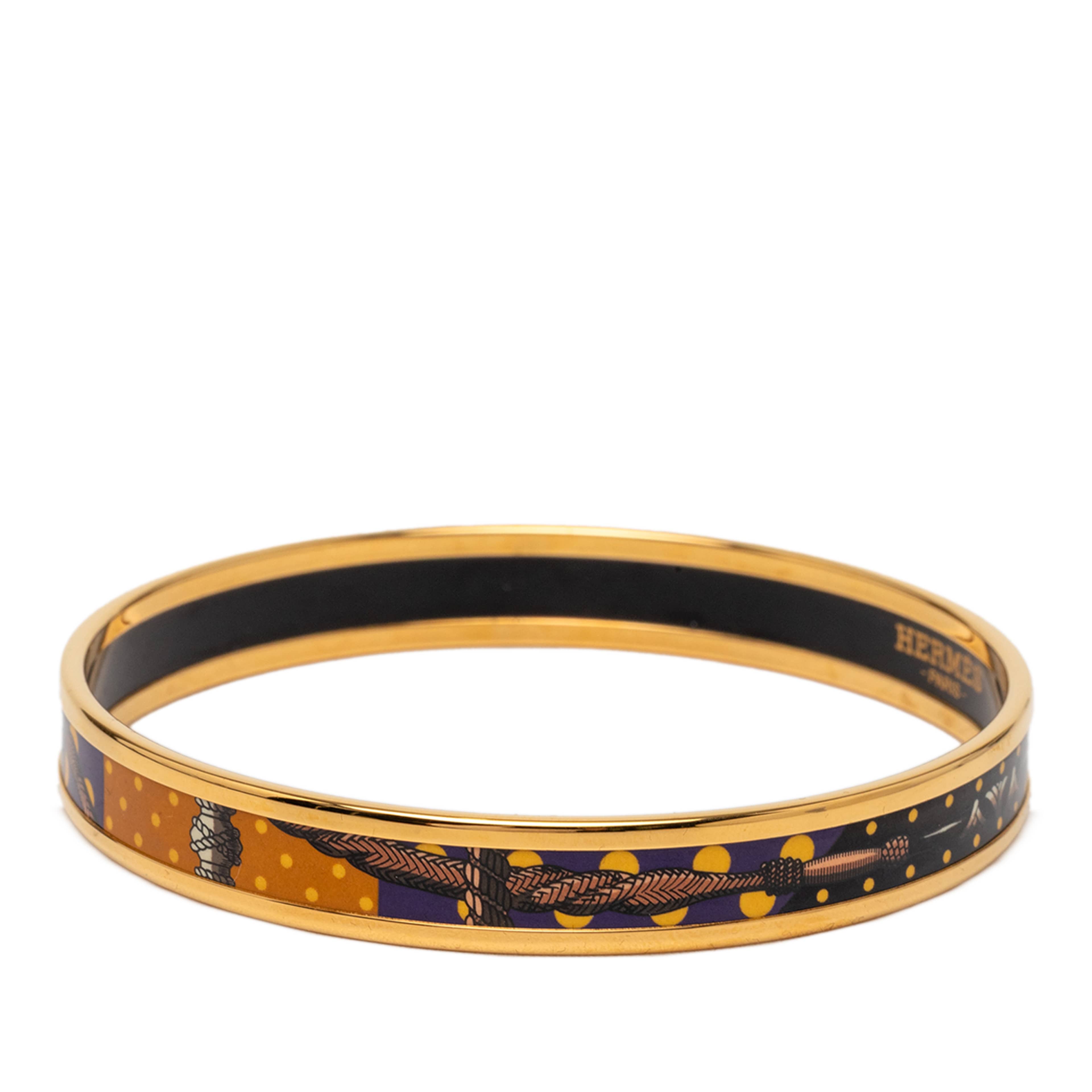 Hermès Narrow Enamel Clic Clac A Pois Bangle 62, från Luxclusif, i färgen gold. Klicka för att öppna bilden i stort format