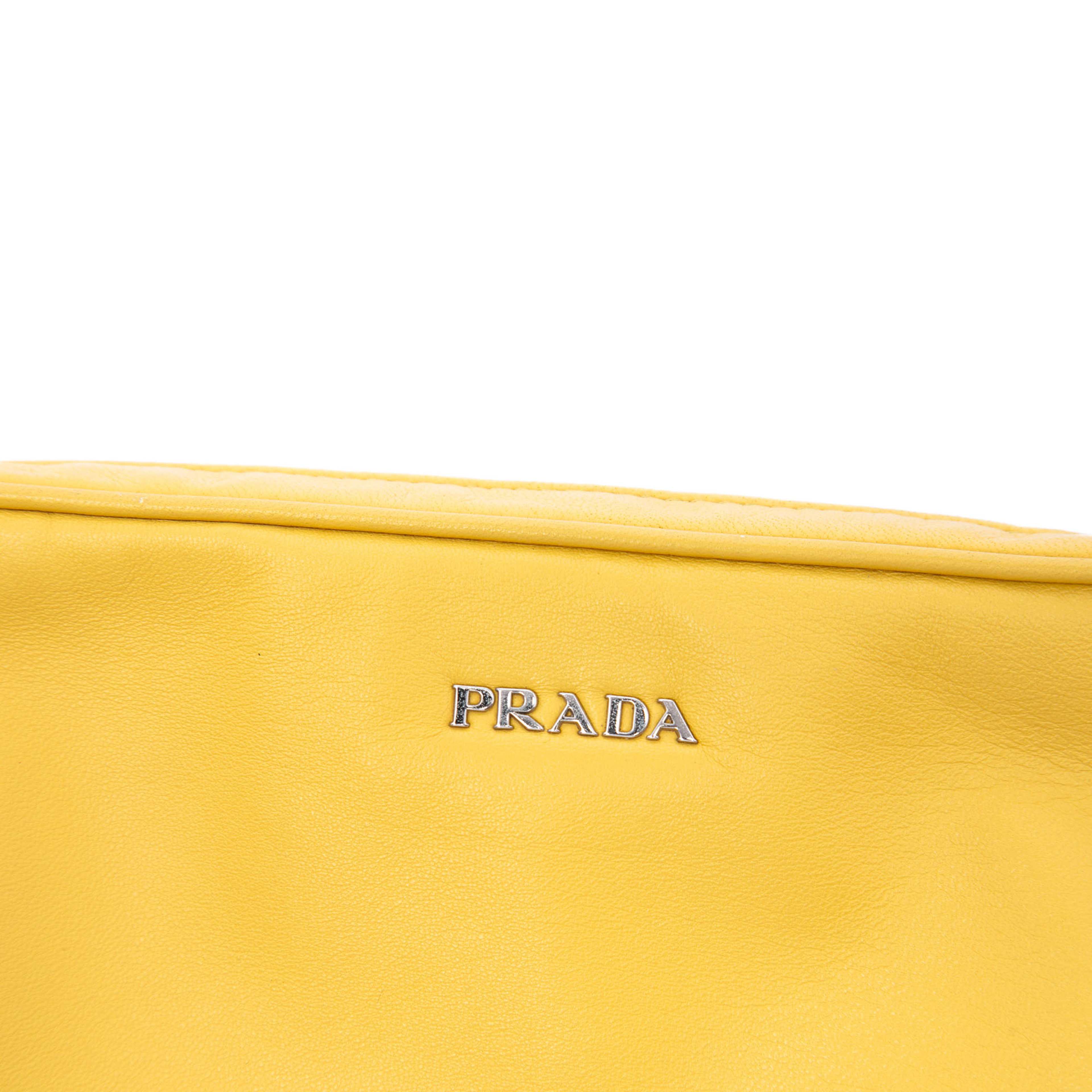 Prada Leather Wristlet Clutch, från Luxclusif, i färgen gul. Klicka för att öppna bilden i stort format