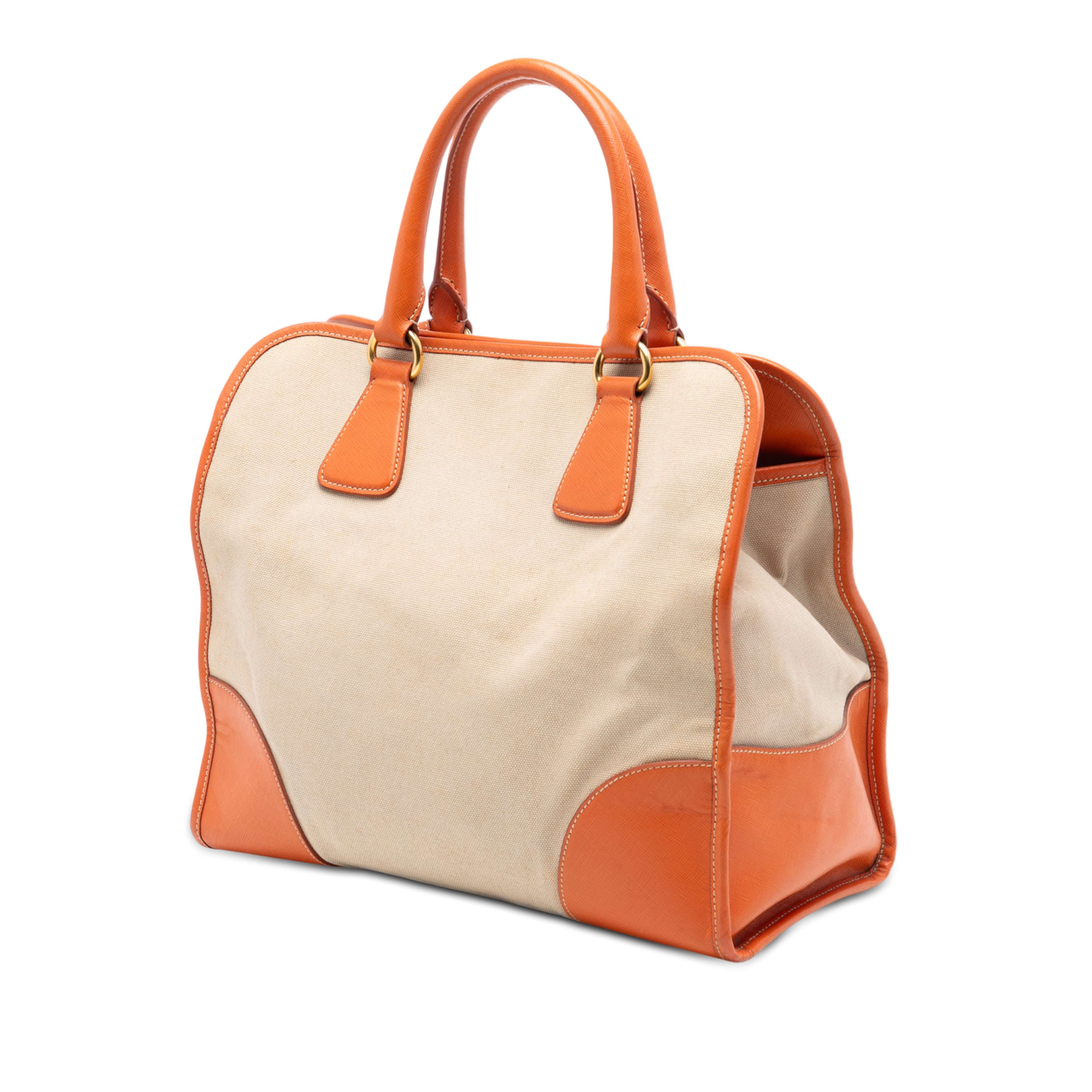 Prada Saffiano Trimmed Canvas Canapa Satchel, från Luxclusif, i färgen beige. Klicka för att öppna bilden i stort format