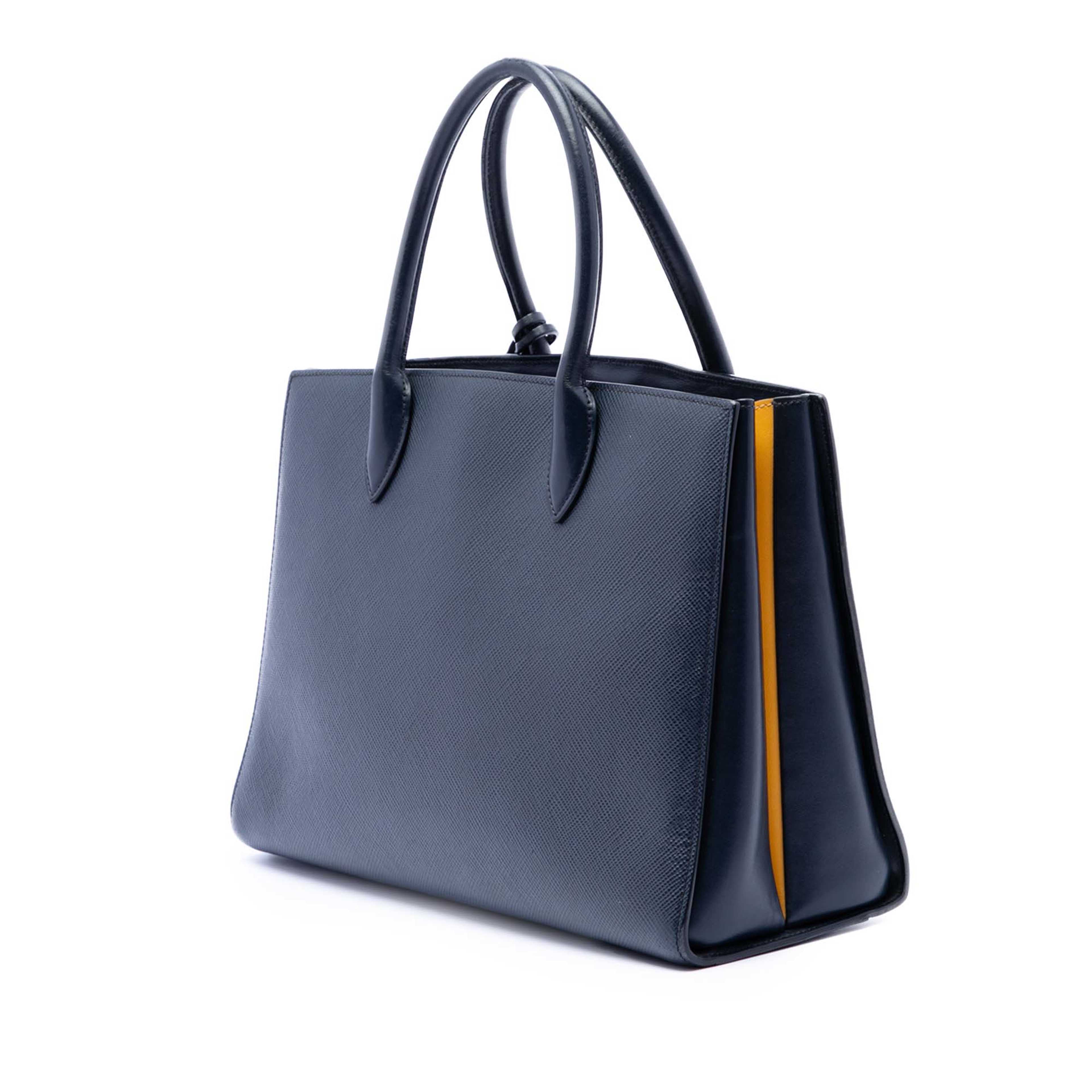 Prada Medium Saffiano Bibliotheque Satchel, från Luxclusif, i färgen navy. Klicka för att öppna bilden i stort format