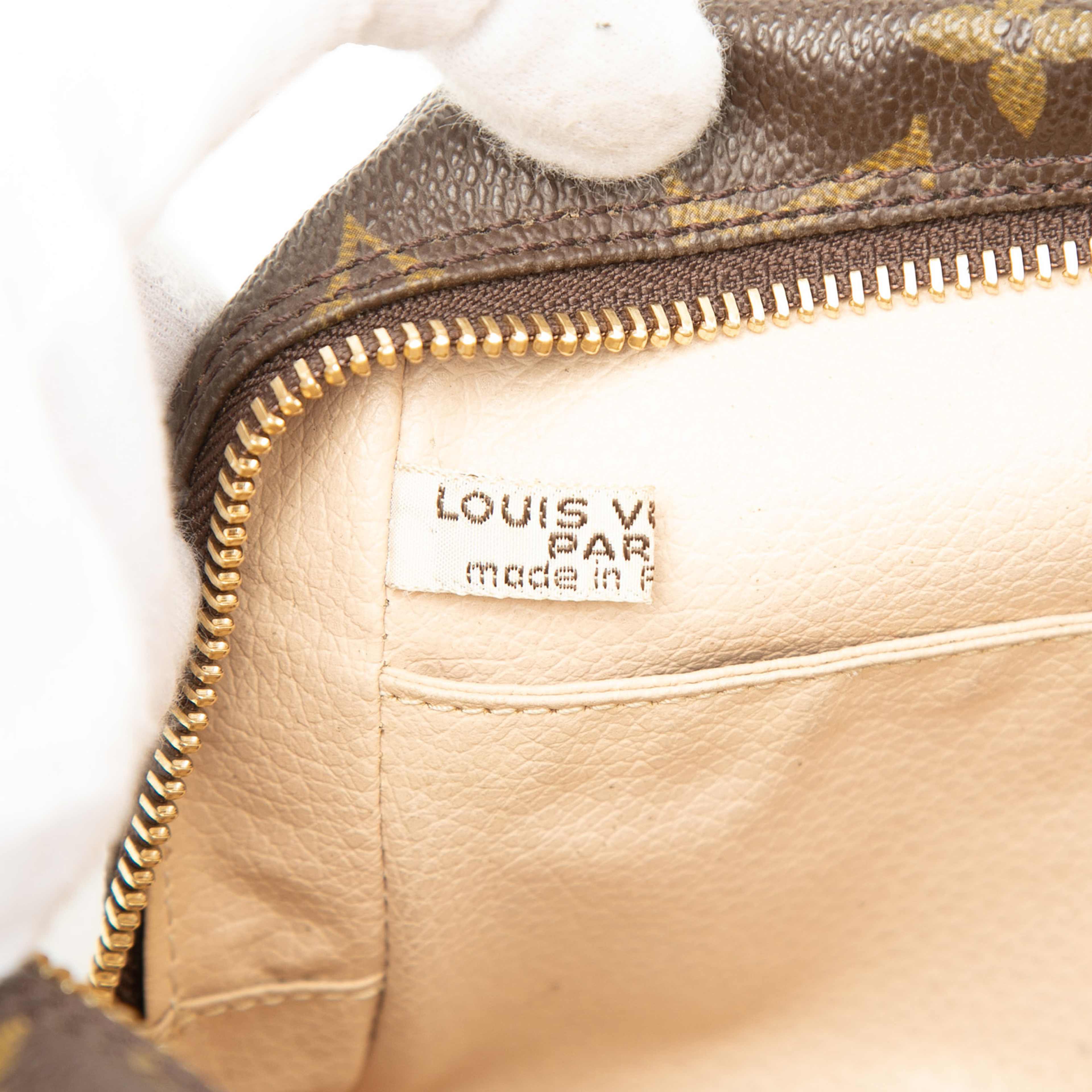 Louis Vuitton Monogram Trousse Toilette 23, från Luxclusif, i färgen brun. Klicka för att öppna bilden i stort format