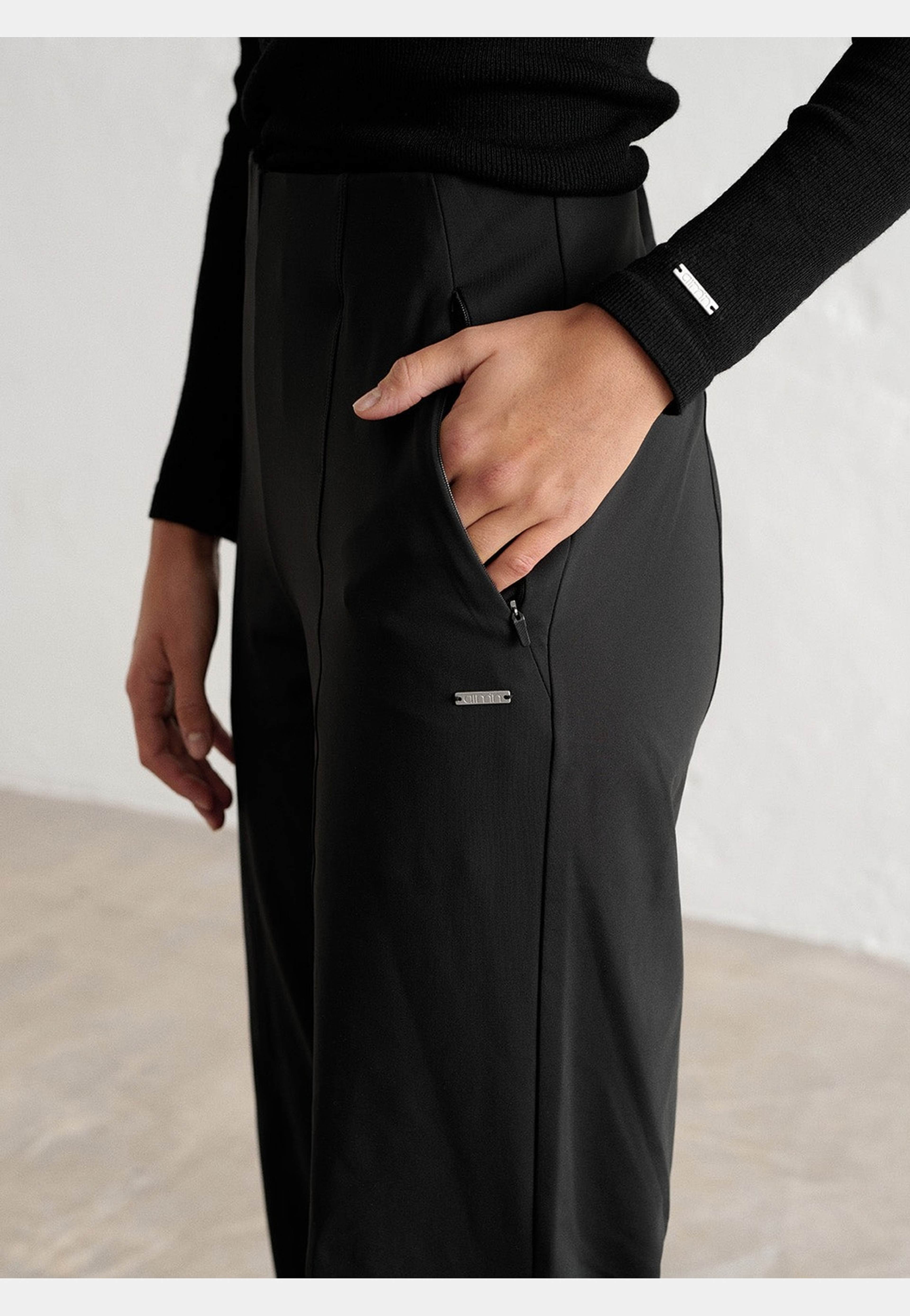 Warming Pintuck Pants, från aim'n, i färgen black. Klicka för att öppna bilden i stort format