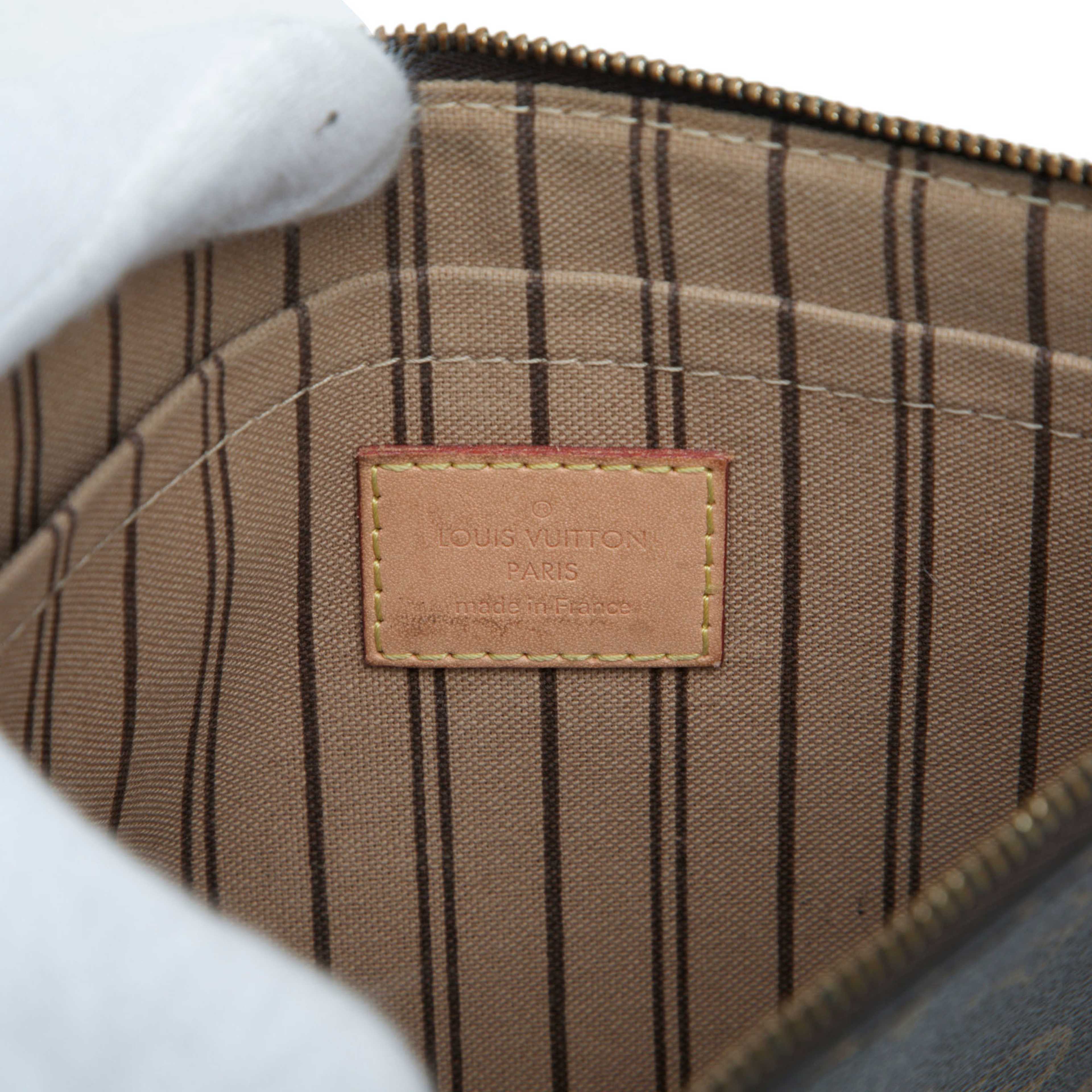 Louis Vuitton Monogram Neverfull Mm Pouch, från Luxclusif, i färgen brun. Klicka för att öppna bilden i stort format