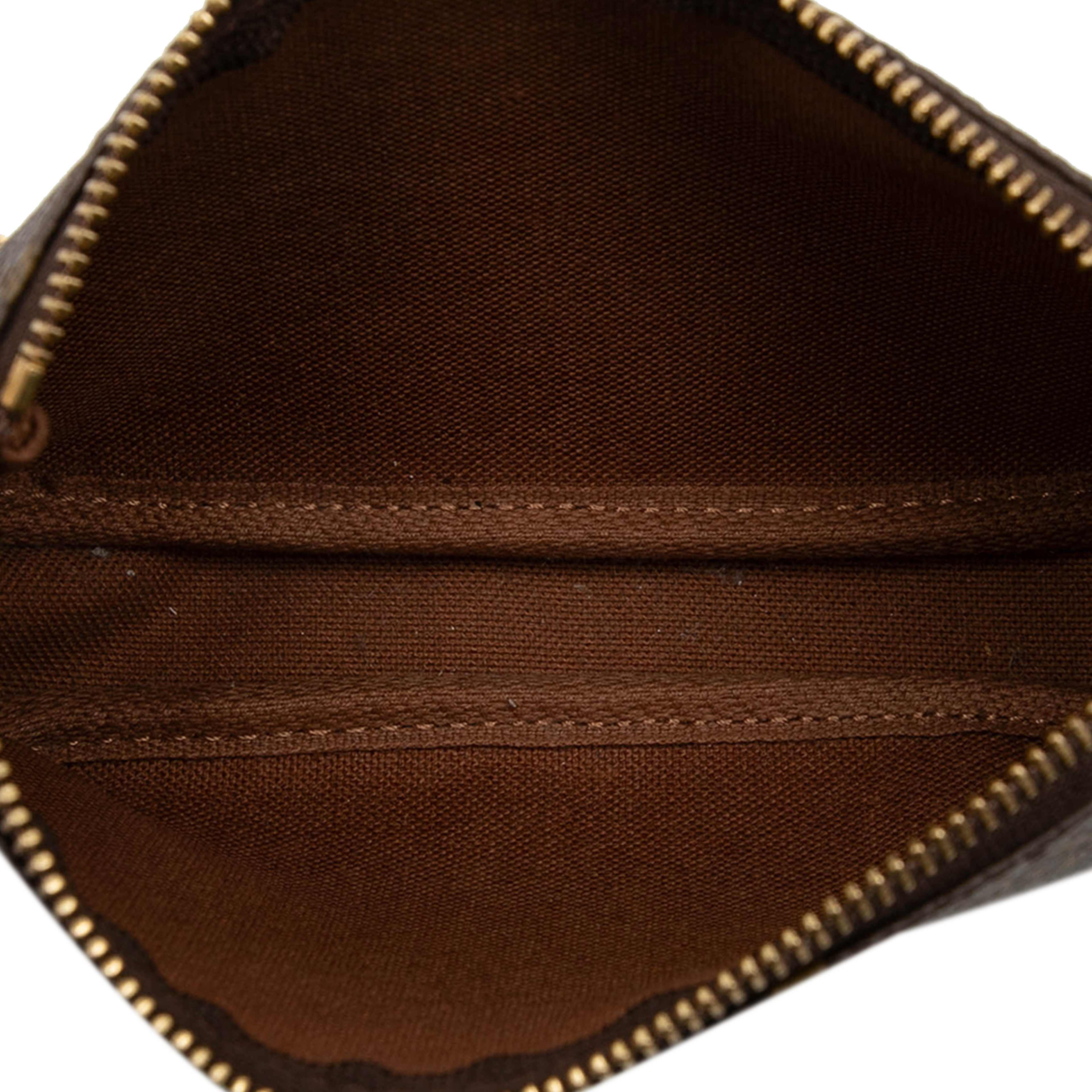 Louis Vuitton Monogram Mini Pochette Accessoires, från Luxclusif, i färgen brown. Klicka för att öppna bilden i stort format