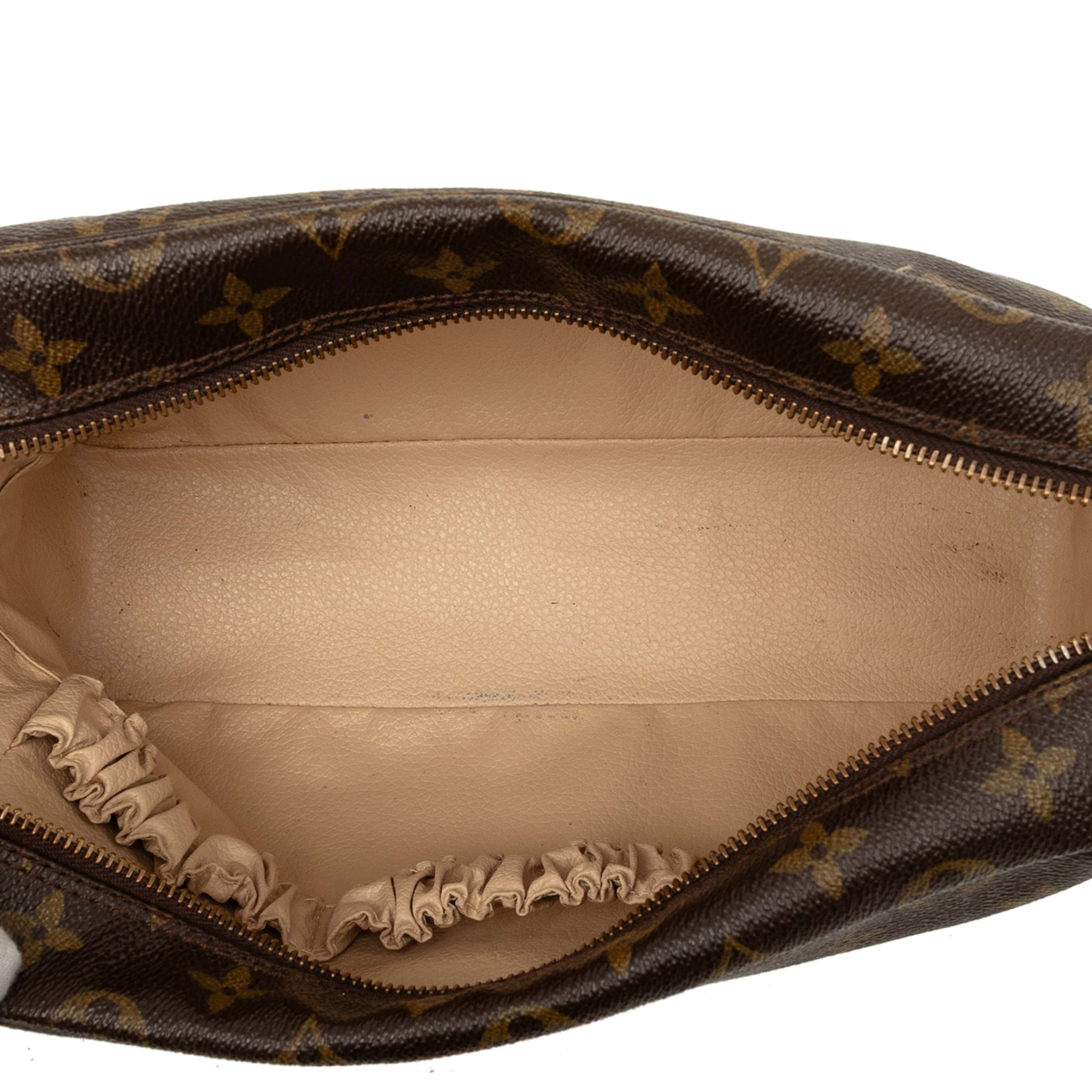 Louis Vuitton Monogram Trousse Toilette 28, från Luxclusif, i färgen brun. Klicka för att öppna bilden i stort format