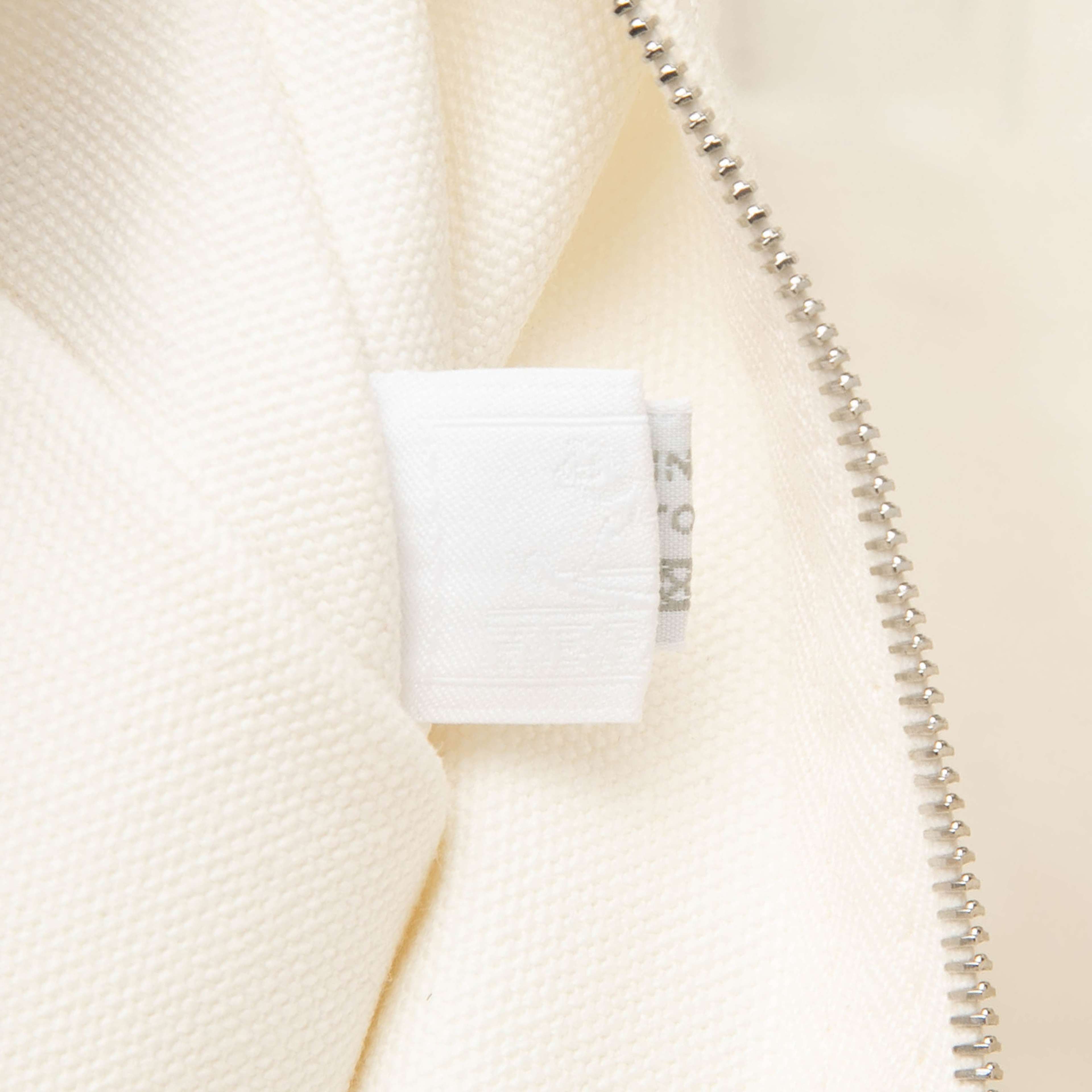 Hermès Canvas Adada Nappy Bag, från Luxclusif, i färgen light beige. Klicka för att öppna bilden i stort format