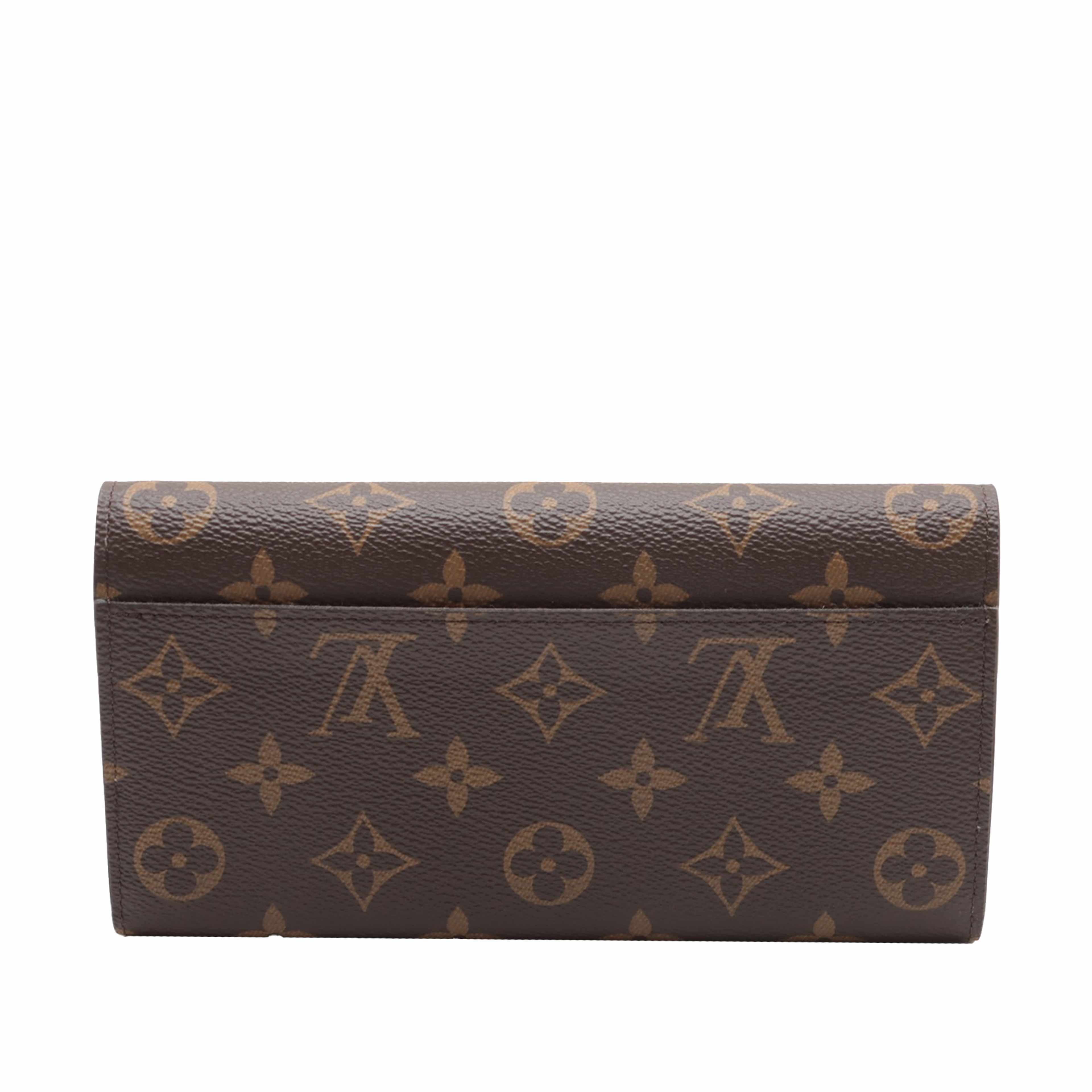 Louis Vuitton Monogram Sarah Wallet, från Luxclusif, i färgen brun. Klicka för att öppna bilden i stort format