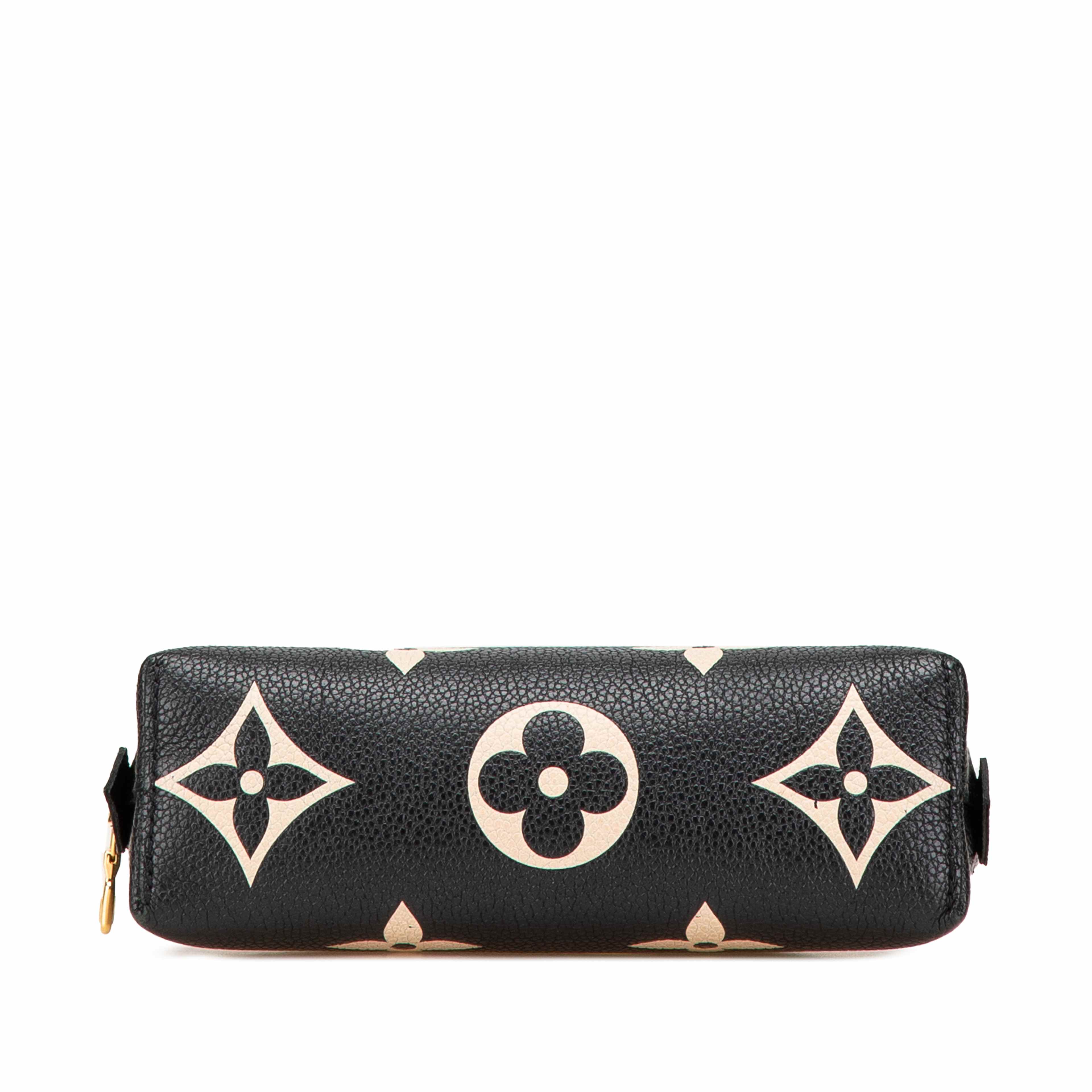 Louis Vuitton Bicolor Monogram Empreinte Giant Cosmetic Pouch, från Luxclusif, i färgen black.