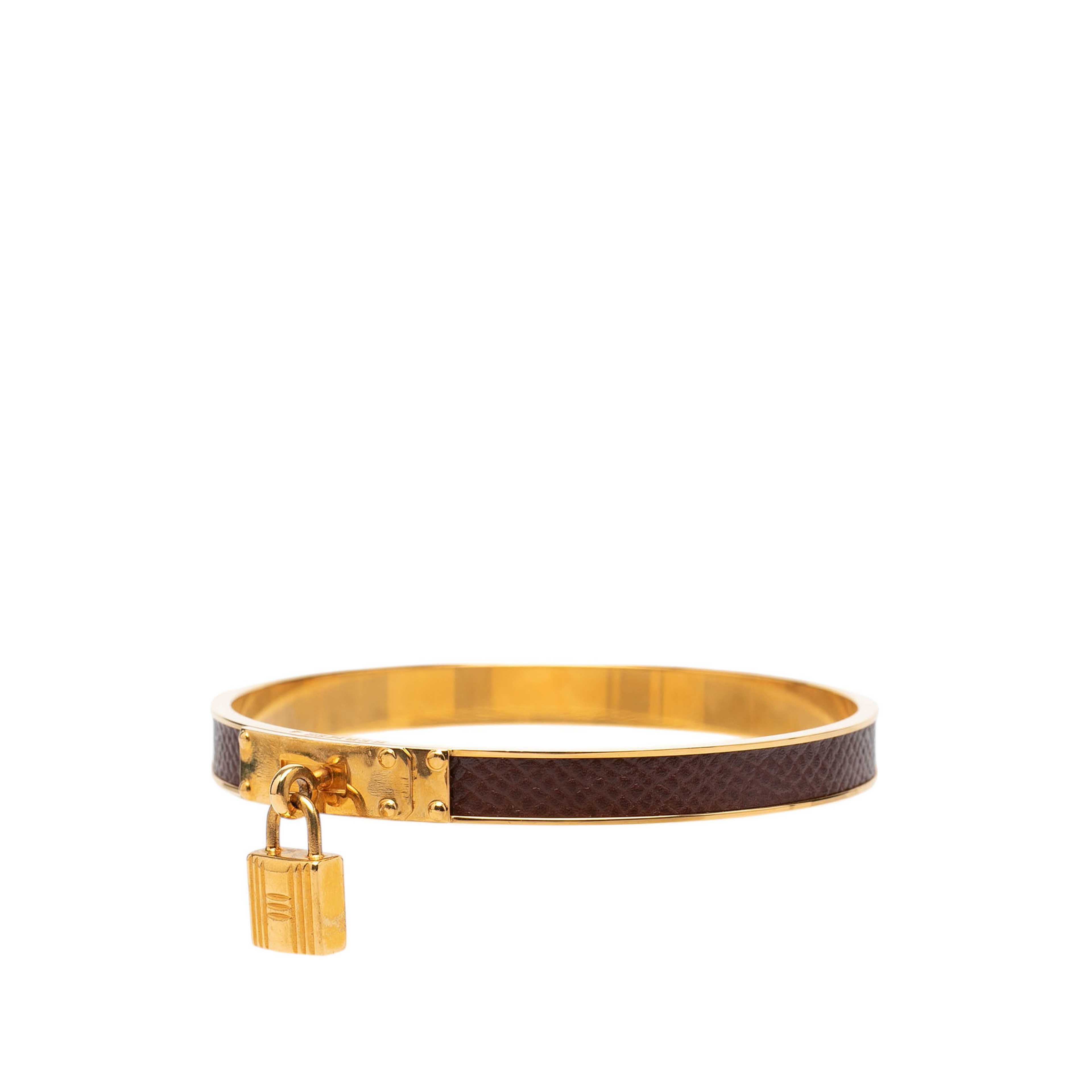 Hermès Gold Plated Epsom Kelly Cadena Lock Bangle Bracelet, från Luxclusif, i färgen brun. Klicka för att öppna bilden i stort format