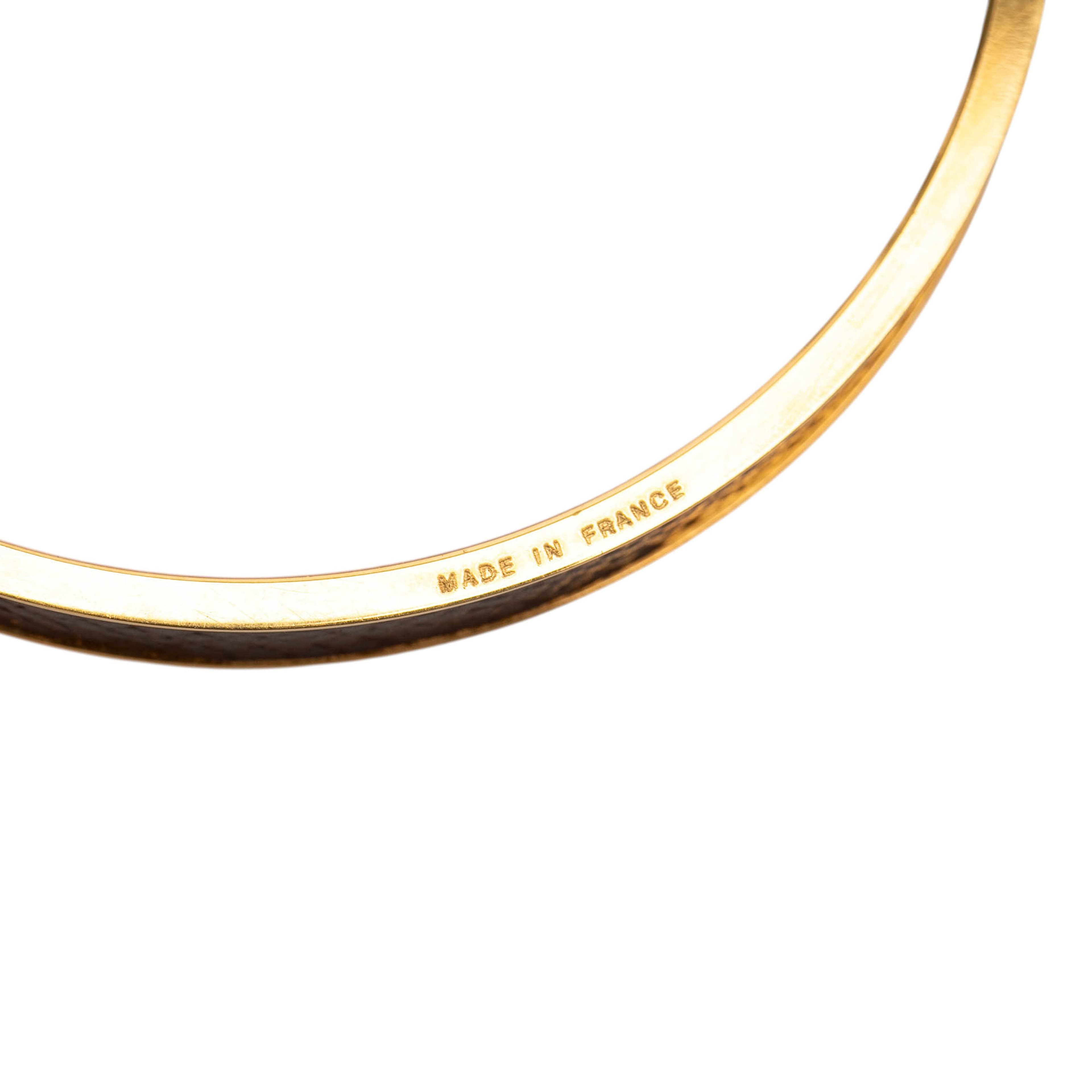 Hermès Gold Plated Epsom Kelly Cadena Lock Bangle Bracelet, från Luxclusif, i färgen brun. Klicka för att öppna bilden i stort format