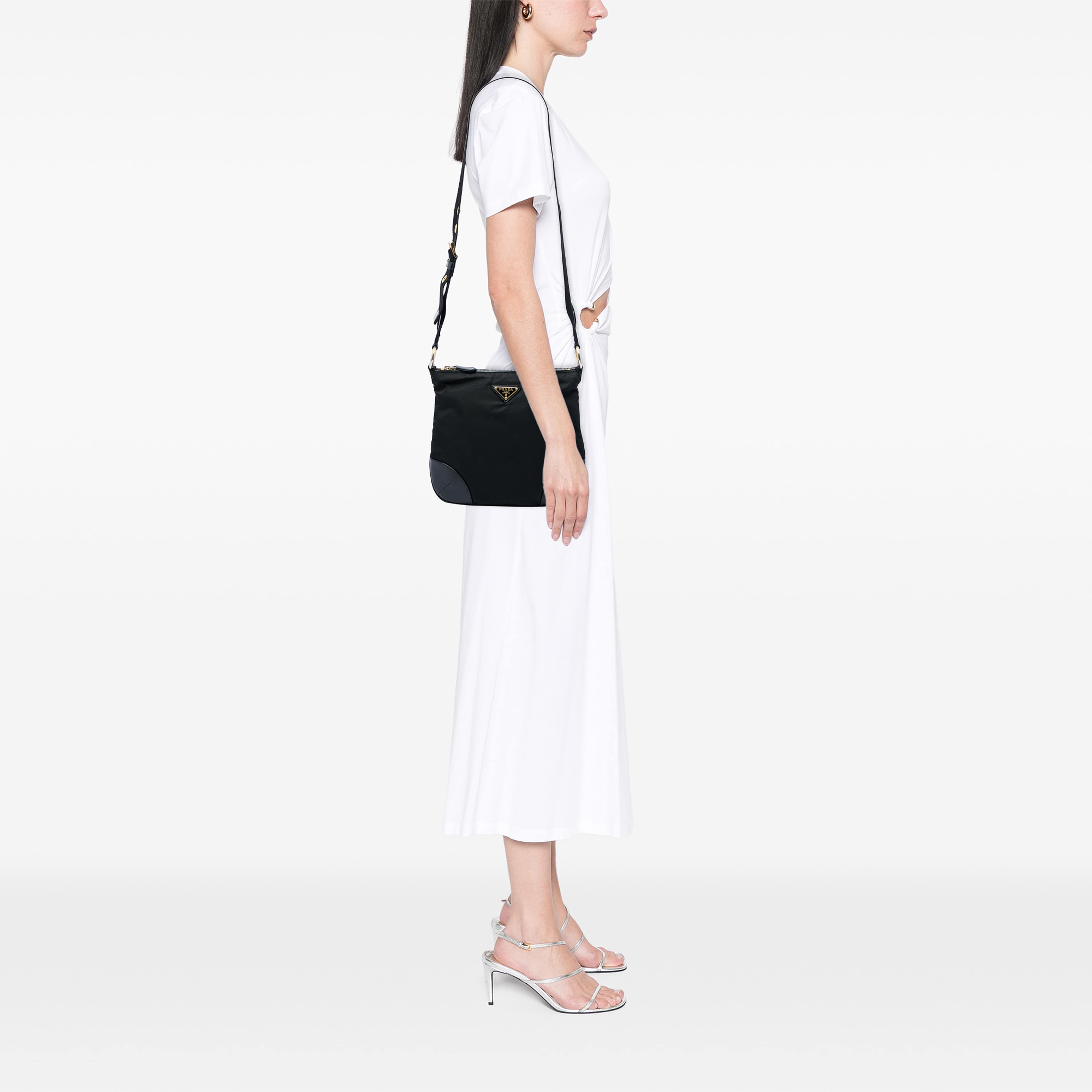 Prada Leather Trimmed Tessuto Zip Top Crossbody, från Luxclusif, i färgen svart. Klicka för att öppna bilden i stort format