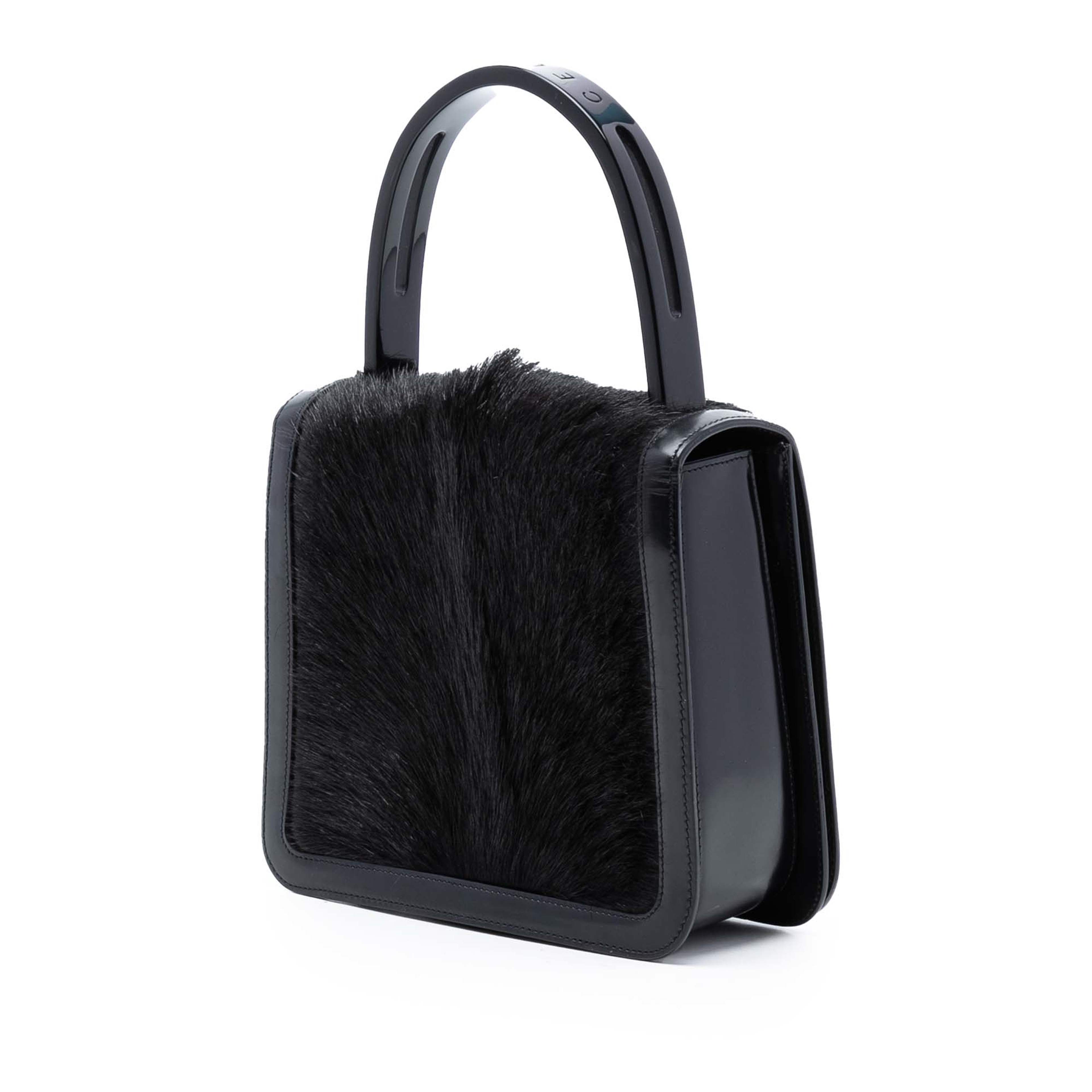 Celine Leather Trimmed Pony Hair Acrylic Top Handle Bag, från Luxclusif, i färgen black. Klicka för att öppna bilden i stort format