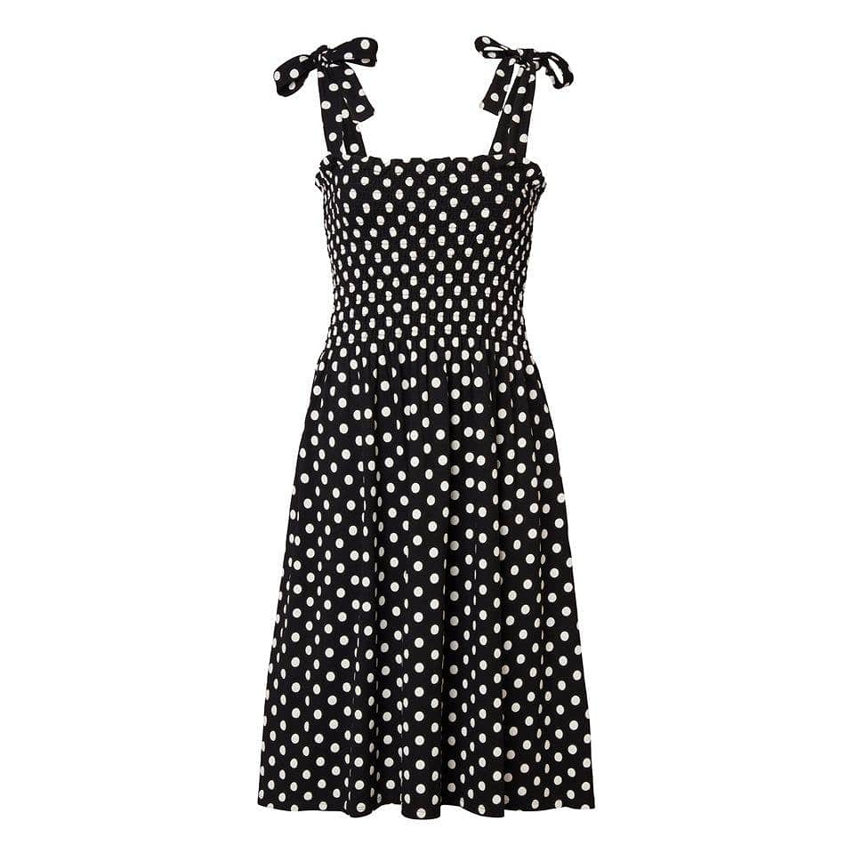 Prickig Solklänning Med Smock  - Nicky Dot Black, från Jumperfabriken, i färgen black.