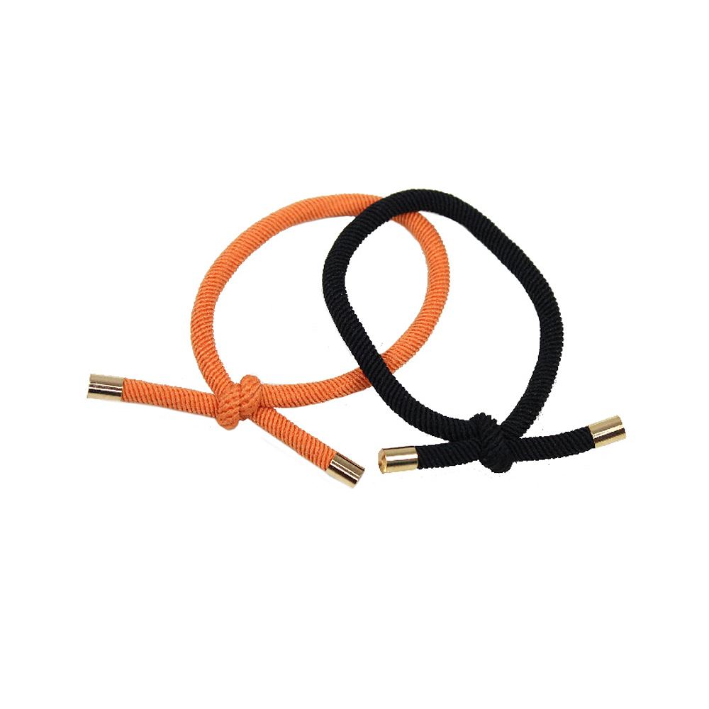 2 Pack Hårsnoddar Med Gulddetalj, från Complement, i färgen orange.