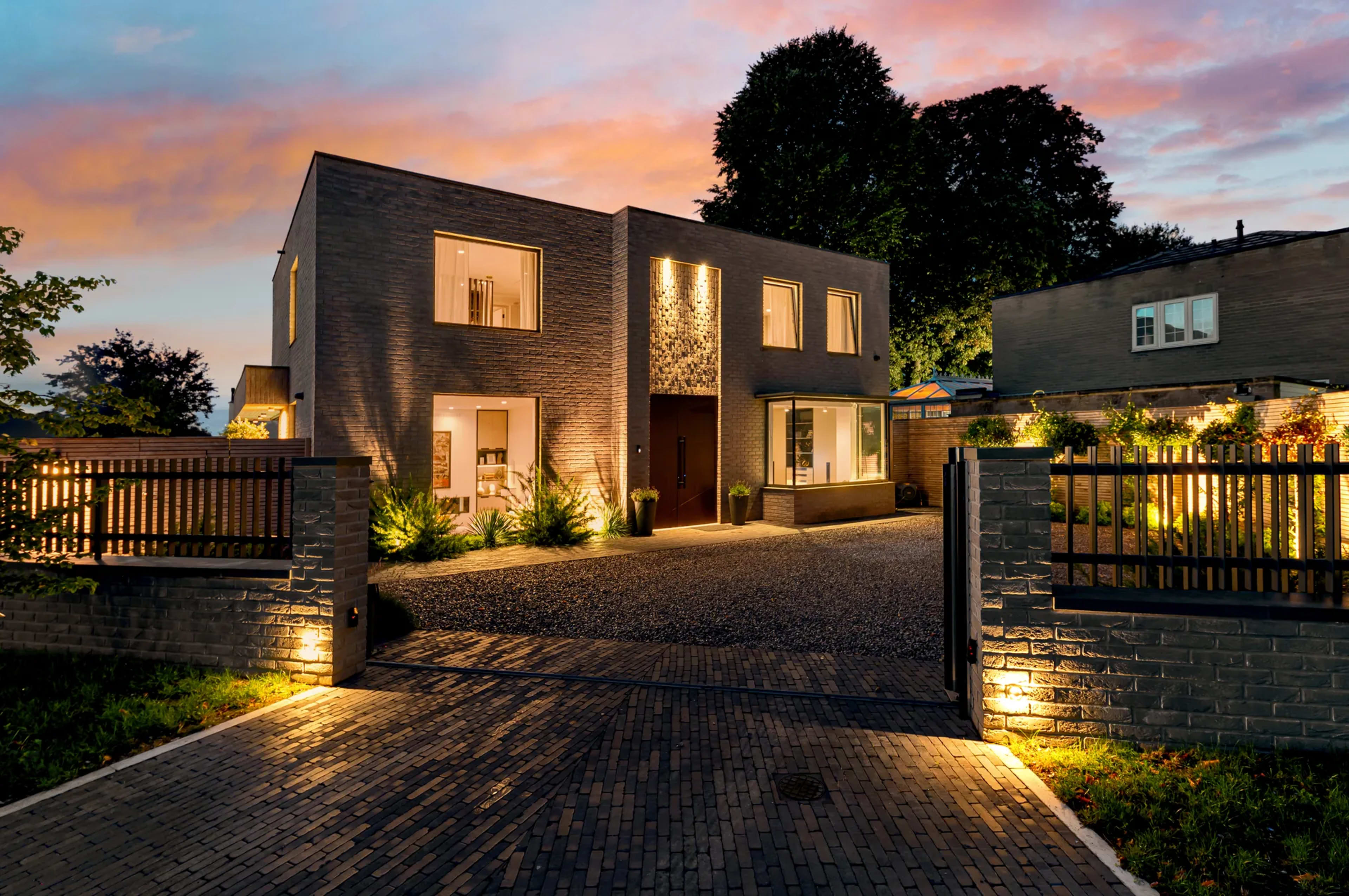 External property photo at dusk with glowing windows