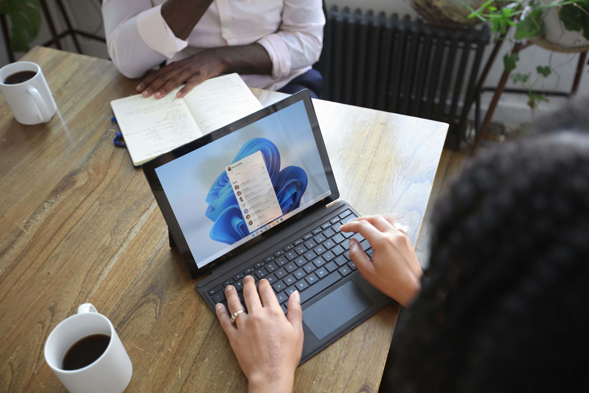 Professional communicating with suppliers digitally