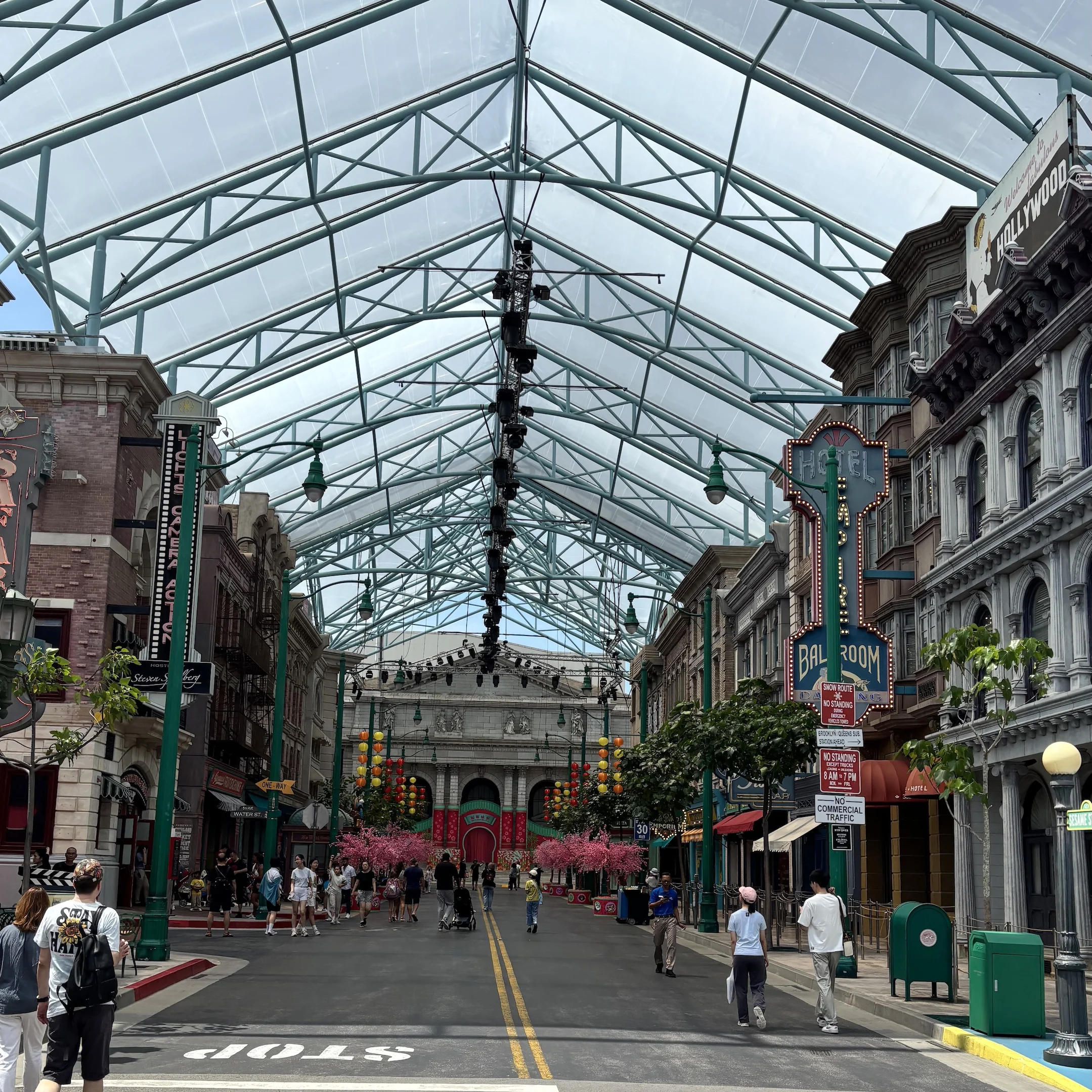 A street with a lot of people walking around.
