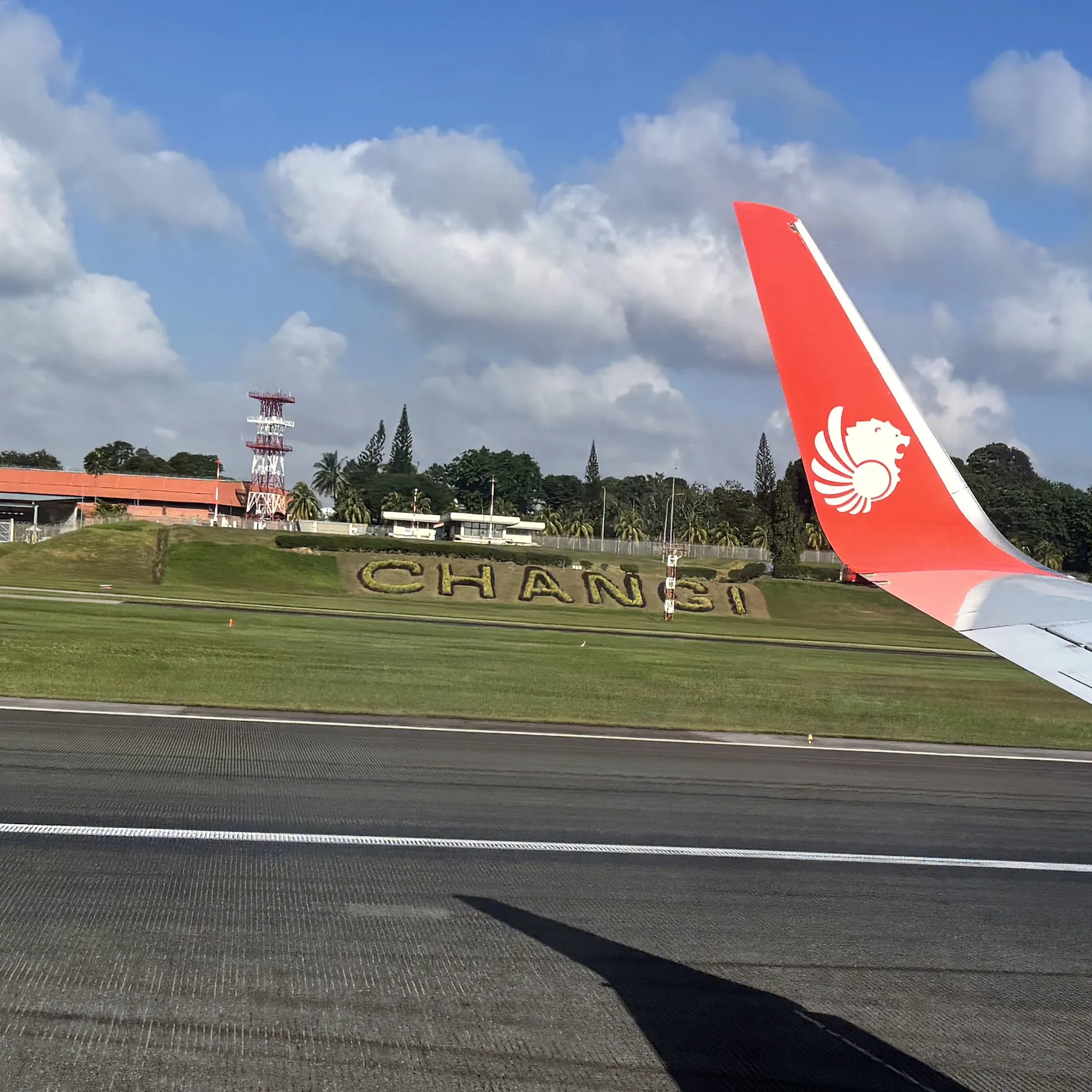A large airplane sitting on top of an airport runway.