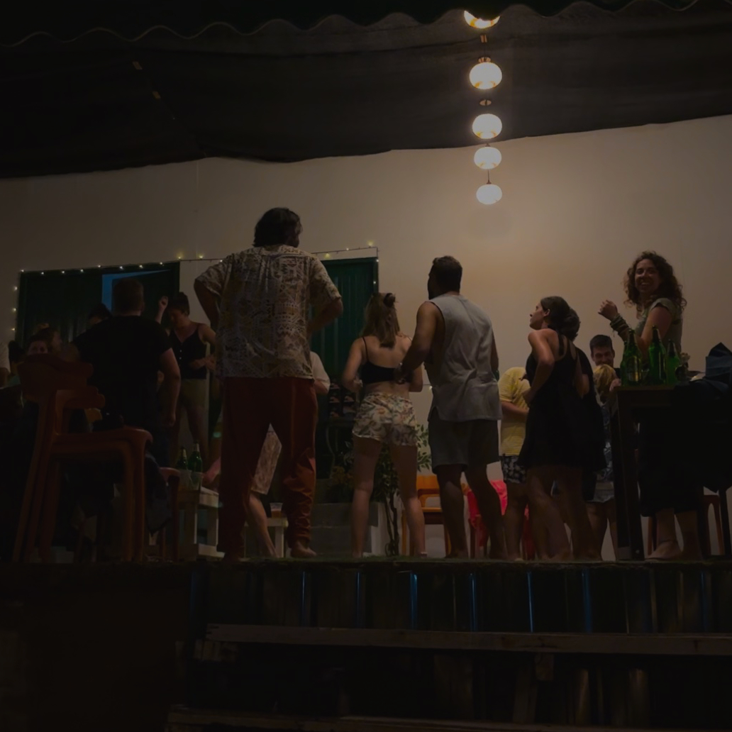 A group of people standing around a table.