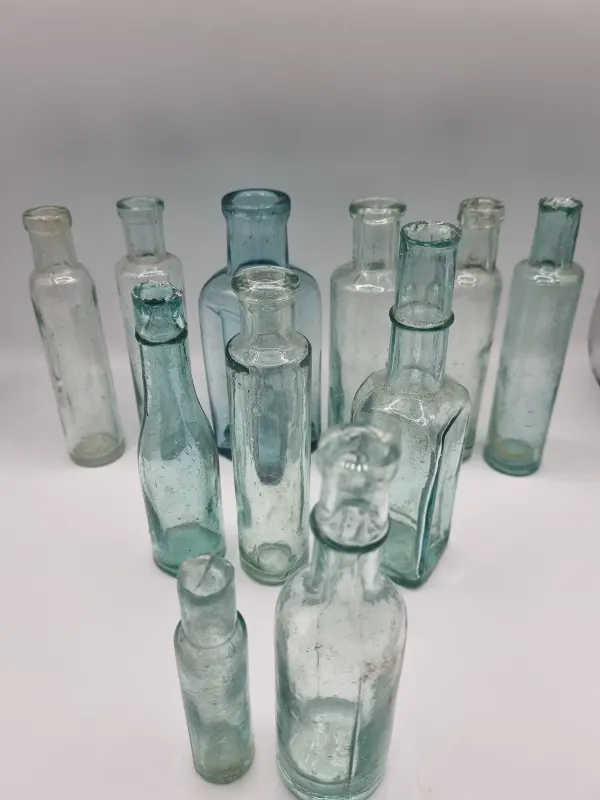 Set of 11 Aqua Vintage Bottles