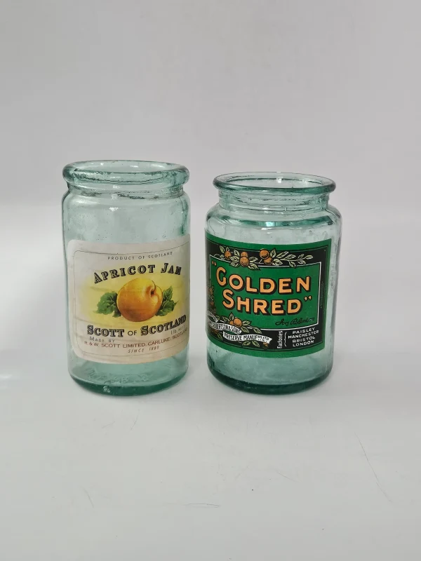 2 LABELLED JAM JARS
