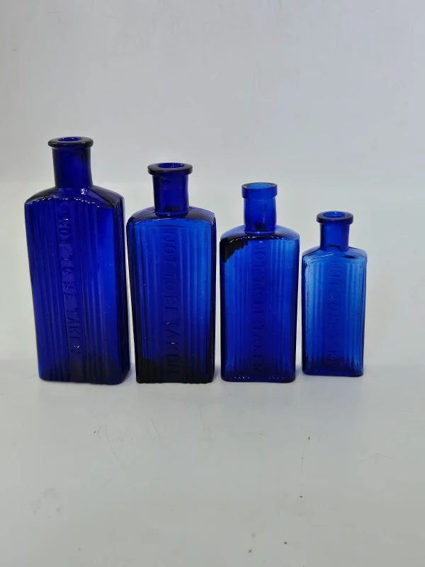 4 OBLONG BLUE POISON BOTTLES