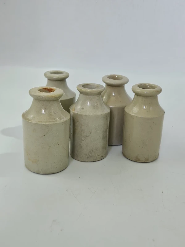 5 WHITE STONEWARE BOTTLES