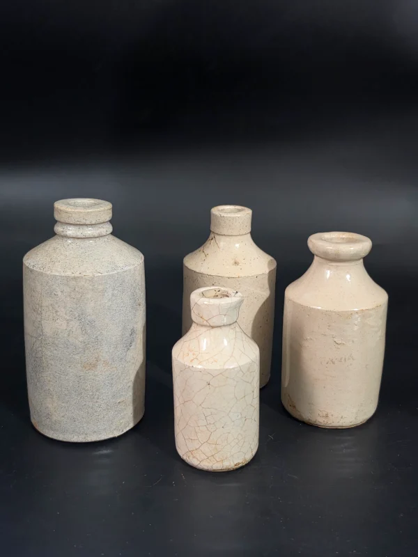 4 WHITE STONEWARE BOTTLES