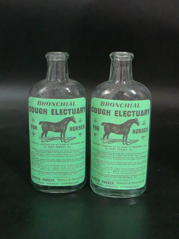 2 HORSE LABELLED BOTTLES