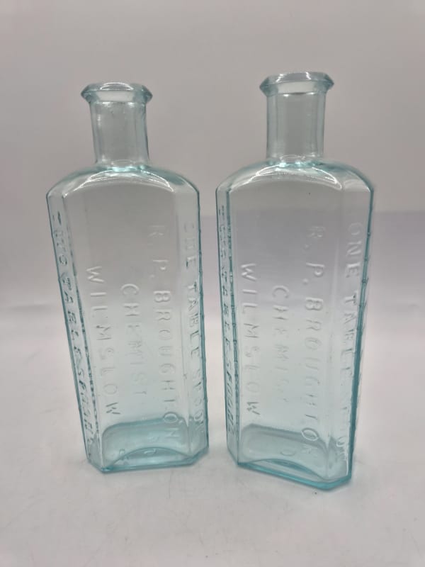 Two Gleaming Wilmslow Chemist Bottles