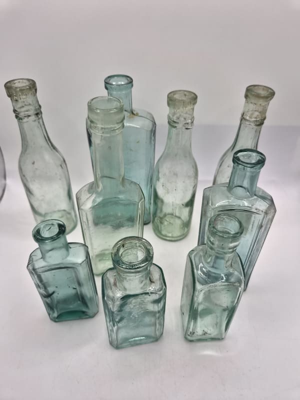 9 Aqua Vintage Bottles