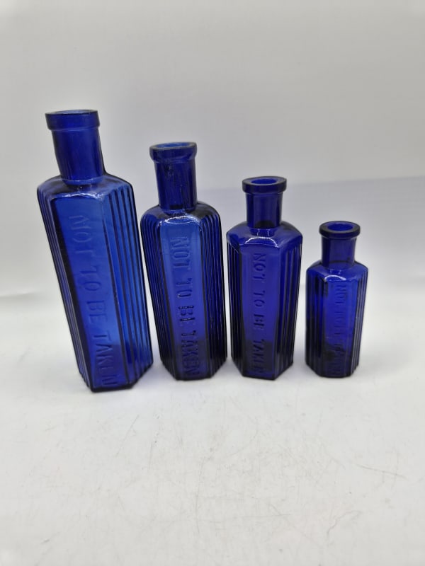 4 Blue Poison Bottles