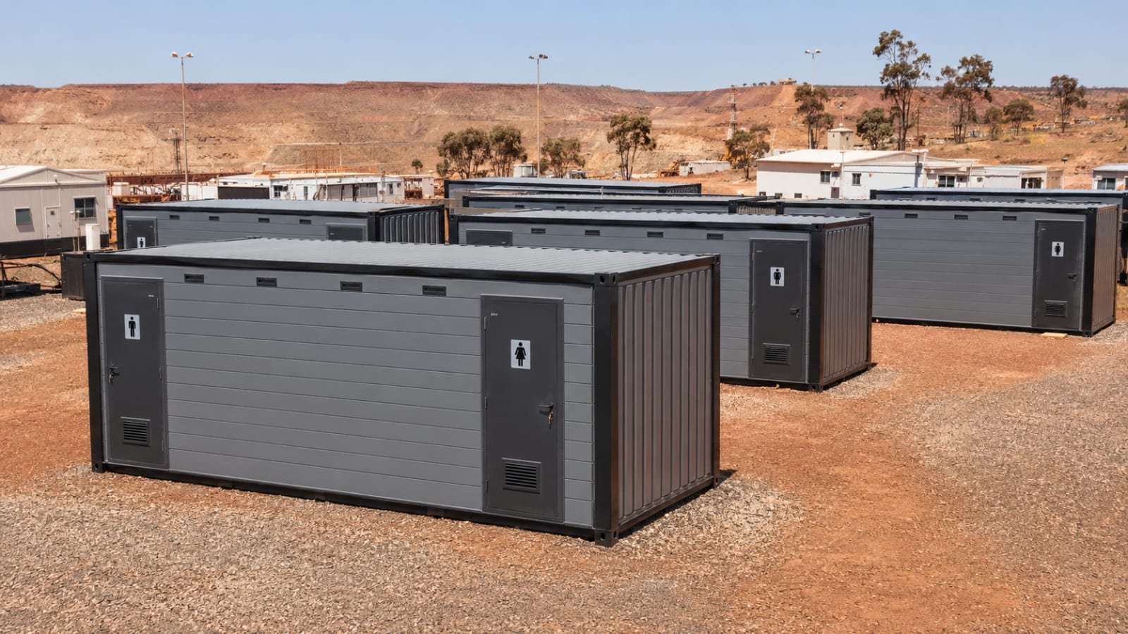 Wide view of a group of container ablution blocks deployed across a remote mining site