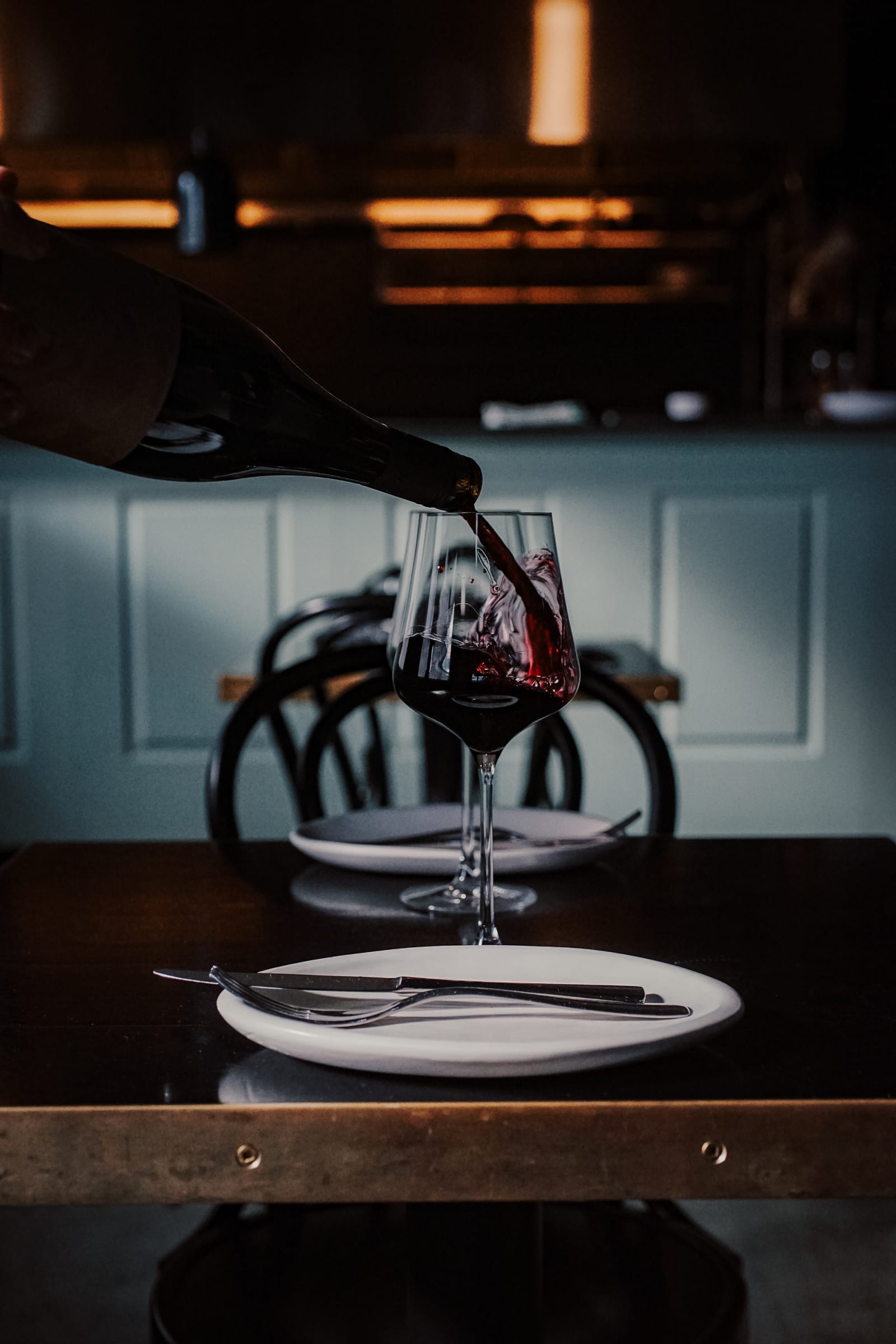 A glass of red being poured at Corella