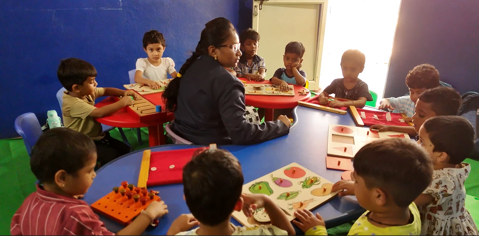 Students working collaboratively on a project at a desk.